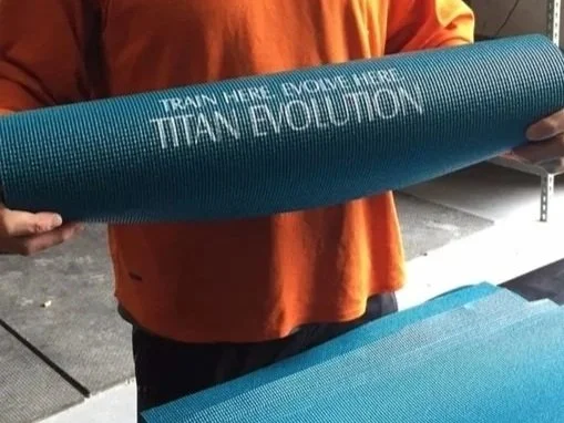 Custom Screen printed Yoga Mat for Titan Evolution fitness in Austin, Tx.