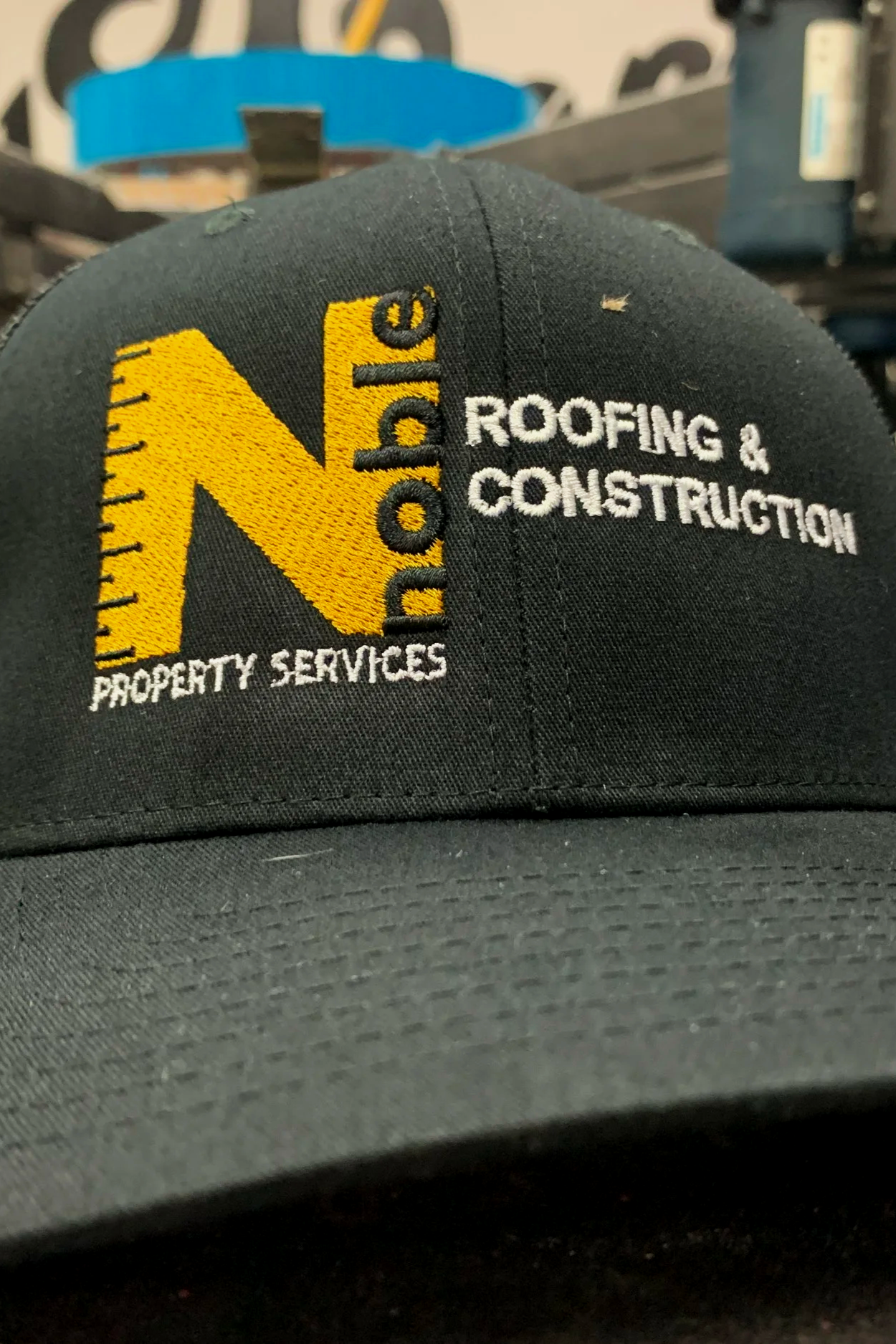 Custom embroidered corporate logo on a business cap.