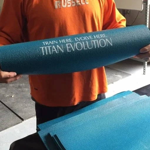 Custom screen printed yoga mats for a Gym in Austin Texas.