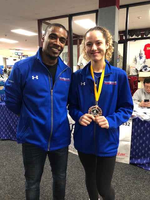 Madison Four-Garcia and Coach Ben. Madison won a Top-8 Medal in Div 1A Women’s Saber.