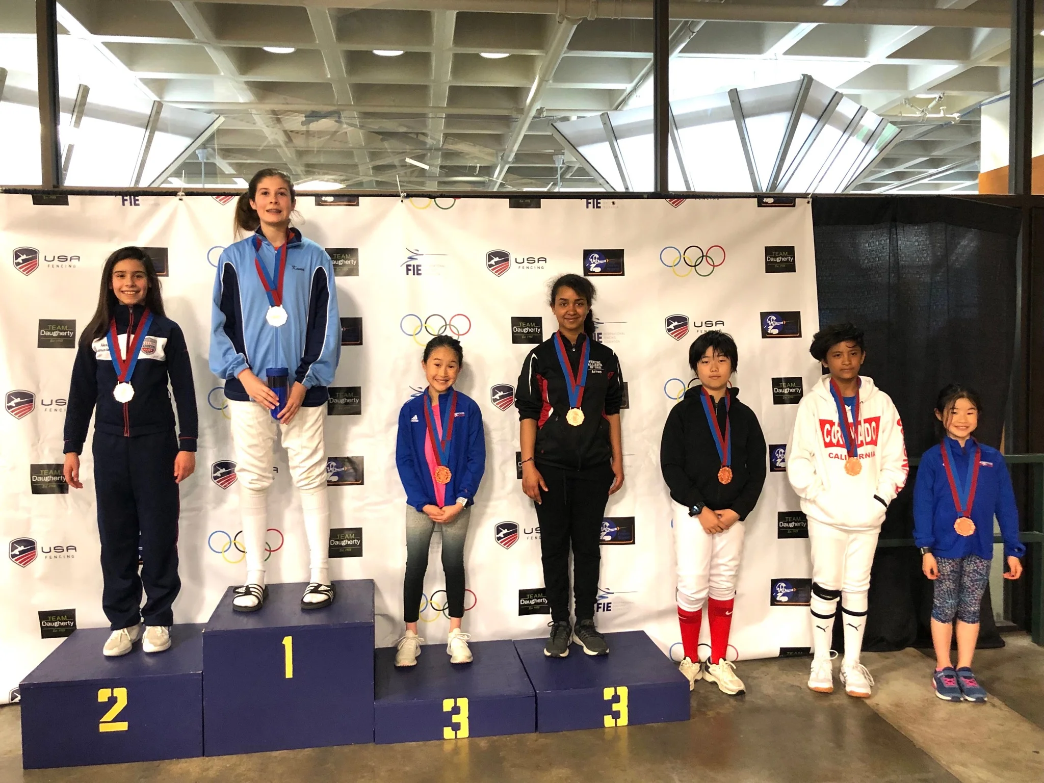 Pictured: Audrey Young wins a Bronze Medal and Charlotte Young wins a Top-8 Medal in Y-12 Women’s Saber