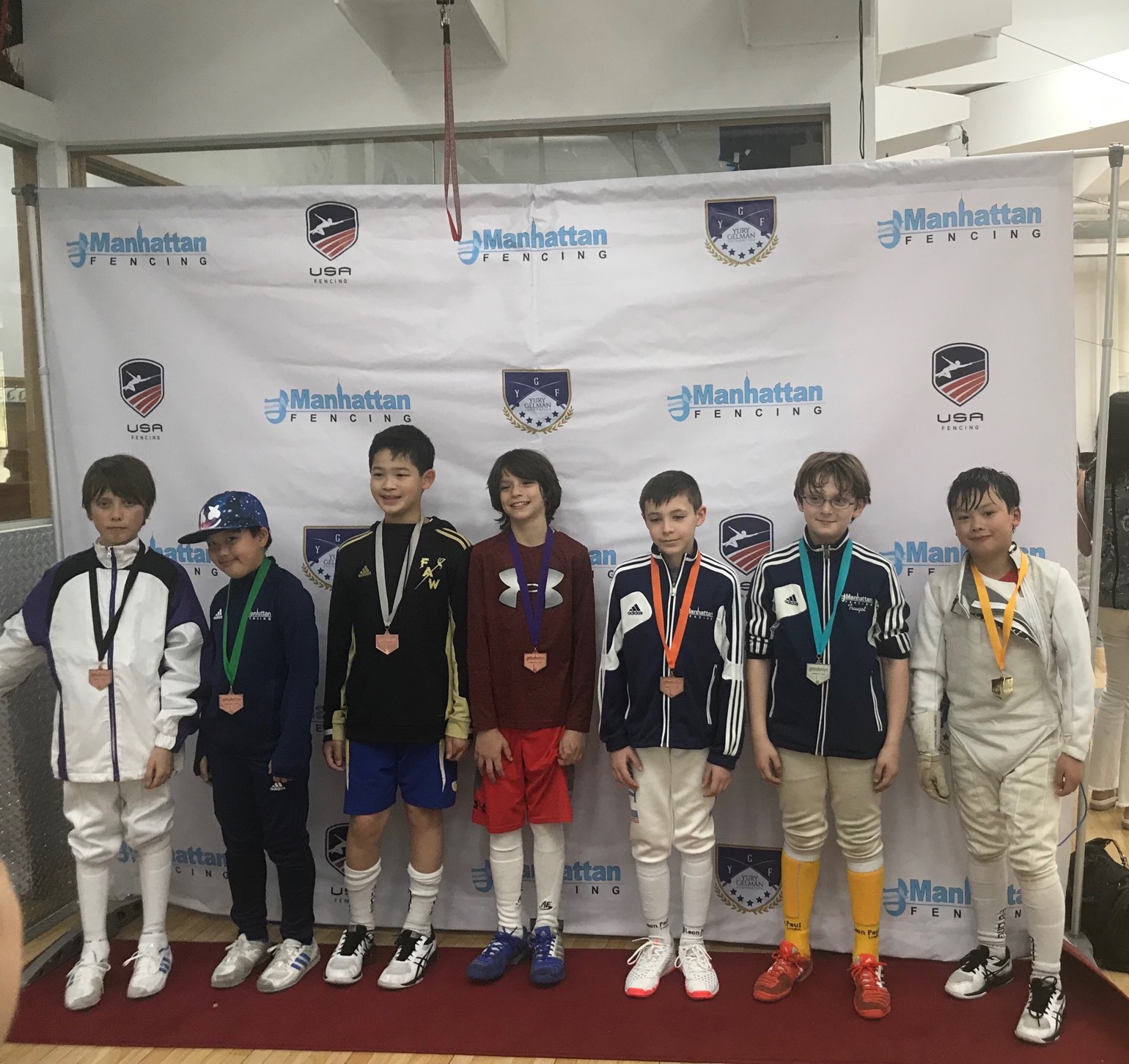 Pictured: Jackson Wong wins a Gold Medal in Y-10 Men's Foil