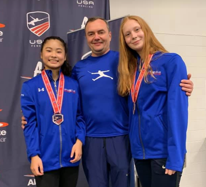 Bronze medalist Sabrina Fang and top-8 medalist Cat Flannagan with Coach Slava.