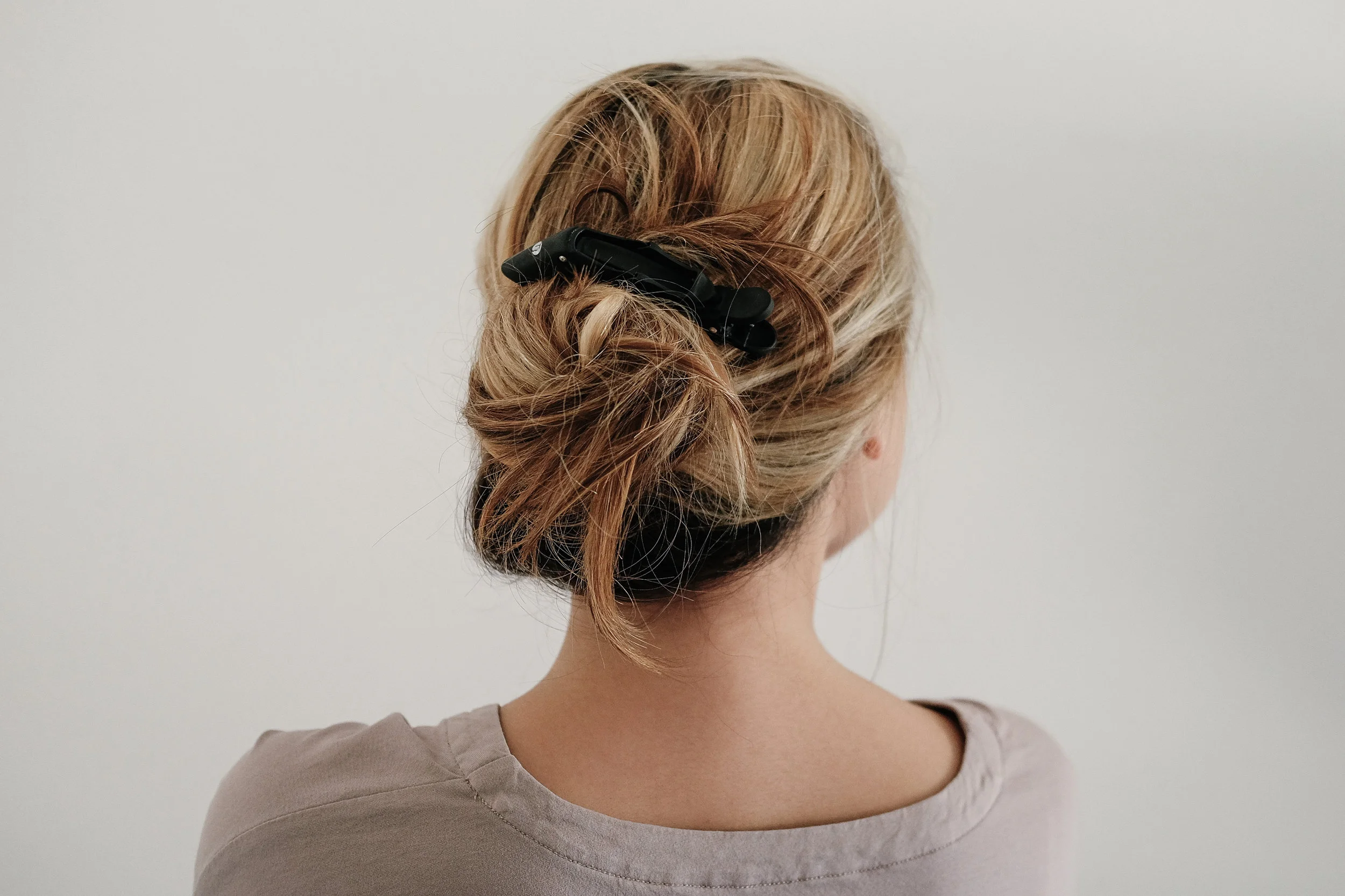 Usually when I sleep my bun is half way out by the time that I wake up, so I'll go ahead and twist it back into place and clamp it in place. Im using the T3 clamps that came with my straightener.&nbsp;
