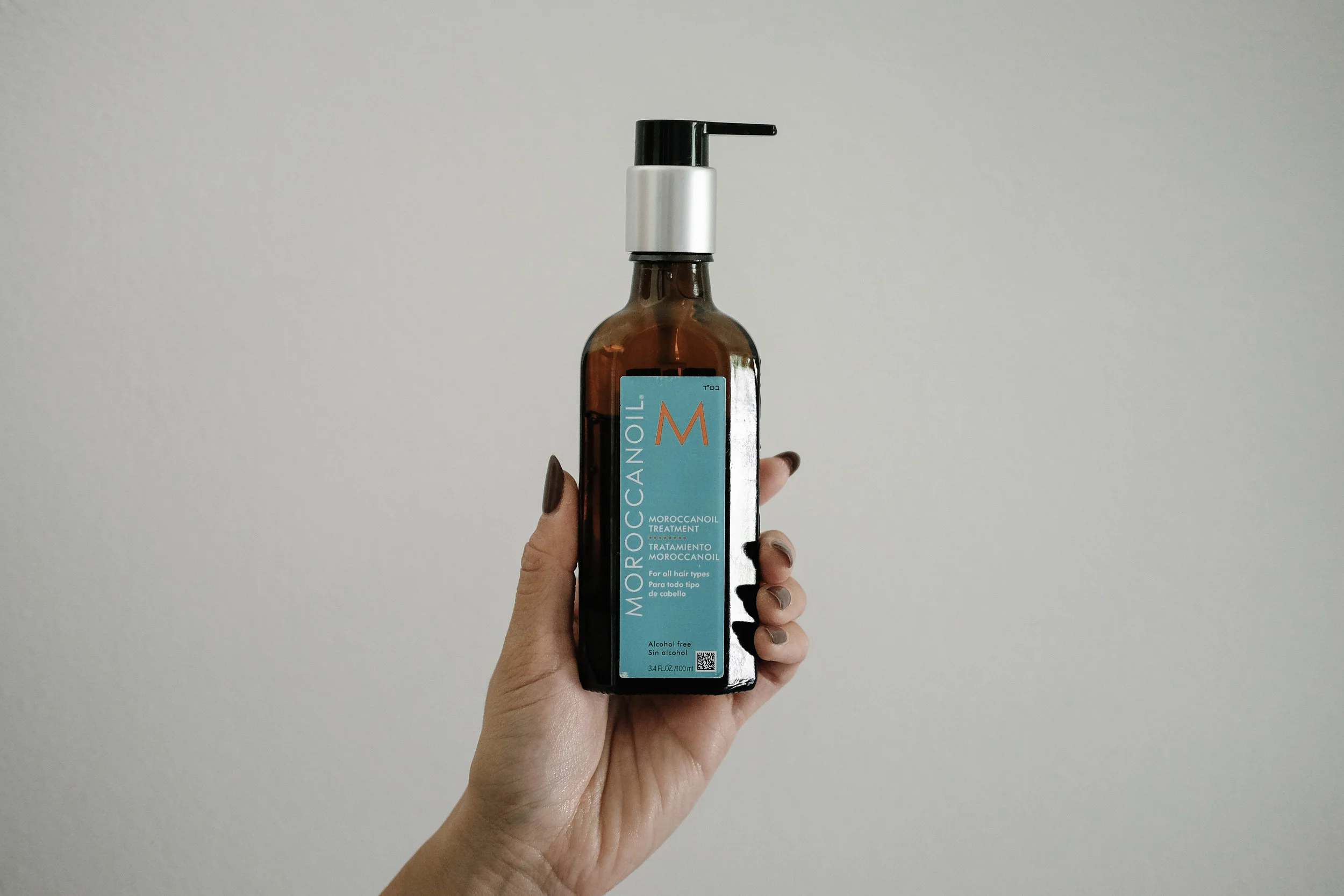 Once I get everything loosely curled, I like to take one pump of this Moroccanoil in my hand and run it through my hair. Applying it to the ends of my hair and my bangs (where my hair is the most dry). This product is great for adding extra moisture…