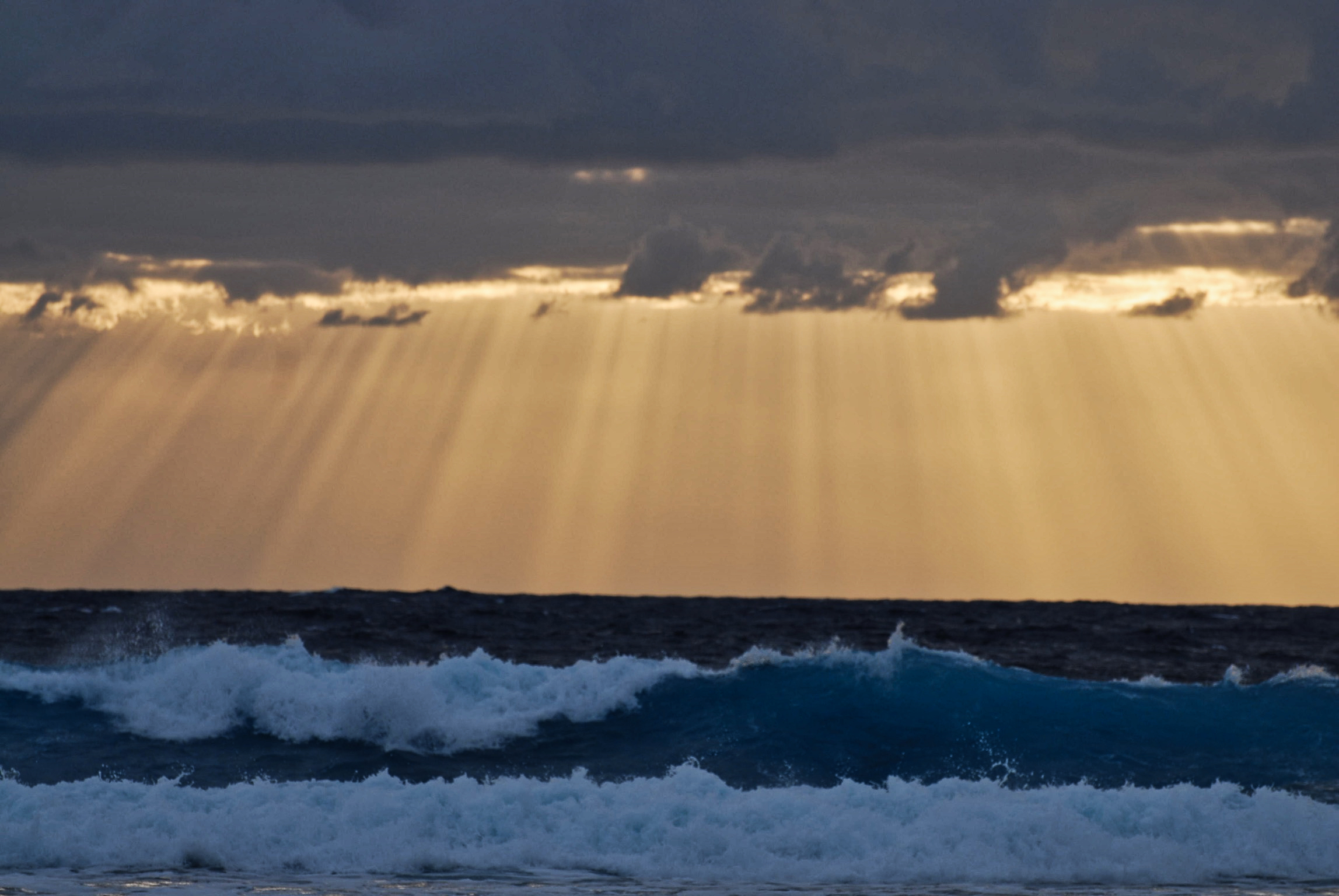 Sunrise on ocean at Kapoho, Hawaii