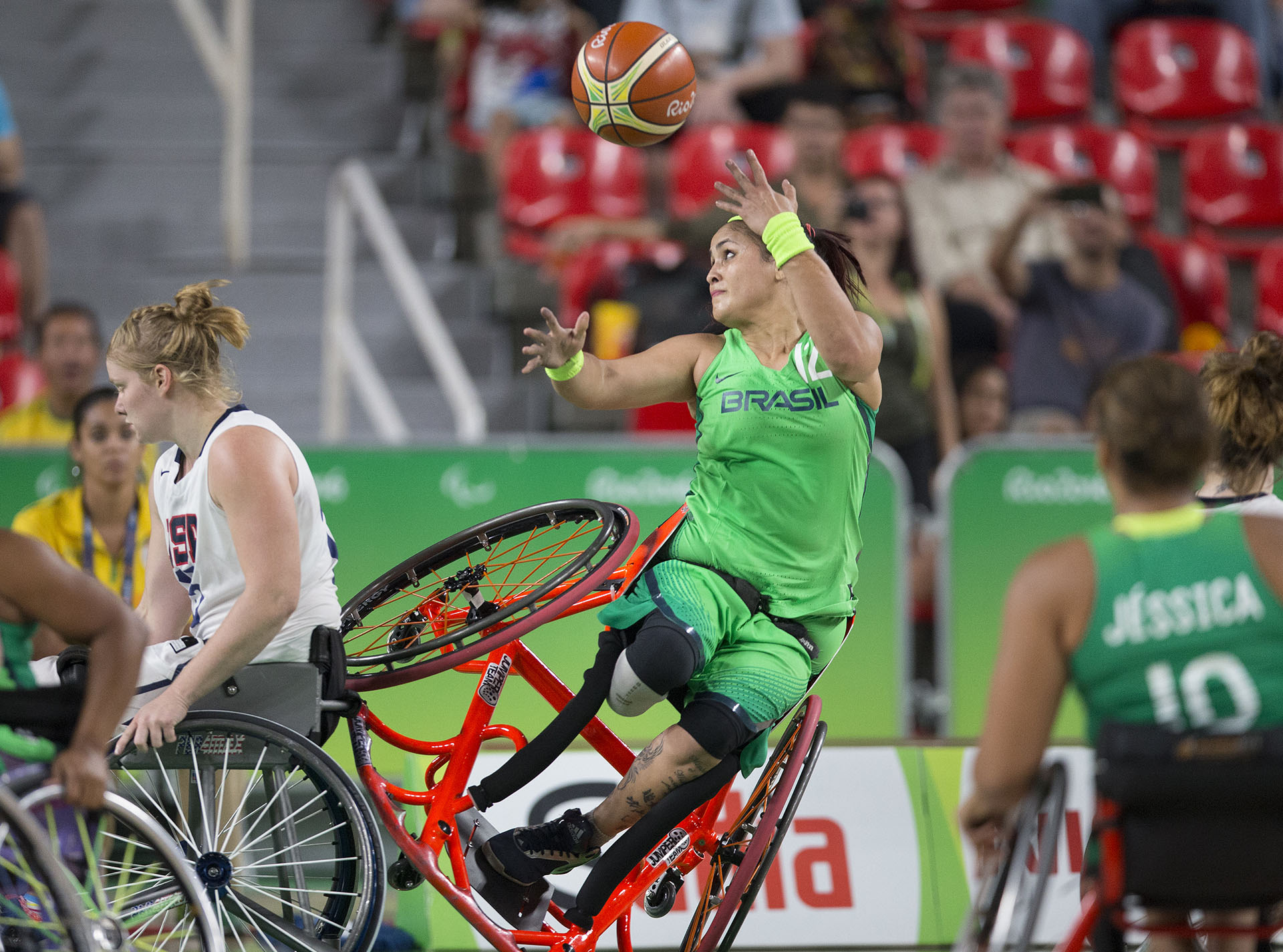  Brazil's Lia Martins takes a shot as she falls to the ground during Brazil's game against the U.S. in the women's wheelchair basketball quarter finals at the 2016 Paralympic Games in Rio de Janeiro, Brazil, on Tuesday, Sept. 13, 2016.&nbsp; 