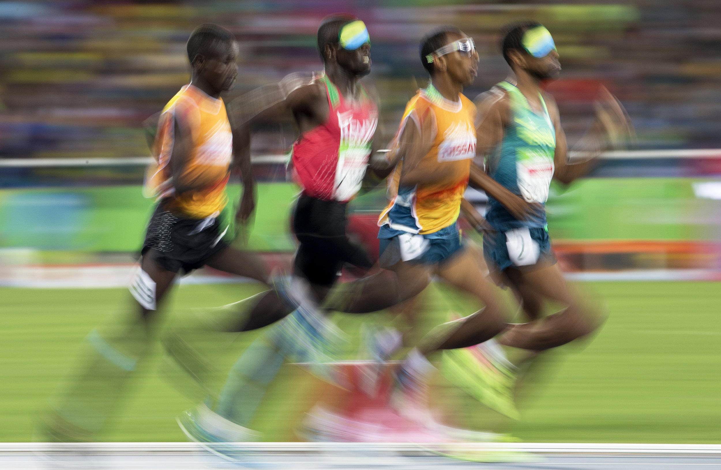  Odair Santos, far right, and Samwel Mushai Kimani, second left, battle it out for gold during the men’s 1500m final at the 2016 Paralympic Games in Rio de Janeiro, Brazil, on Tuesday, Sept. 13, 2016. Samwel Mushai Kimani and his guide James Boit won