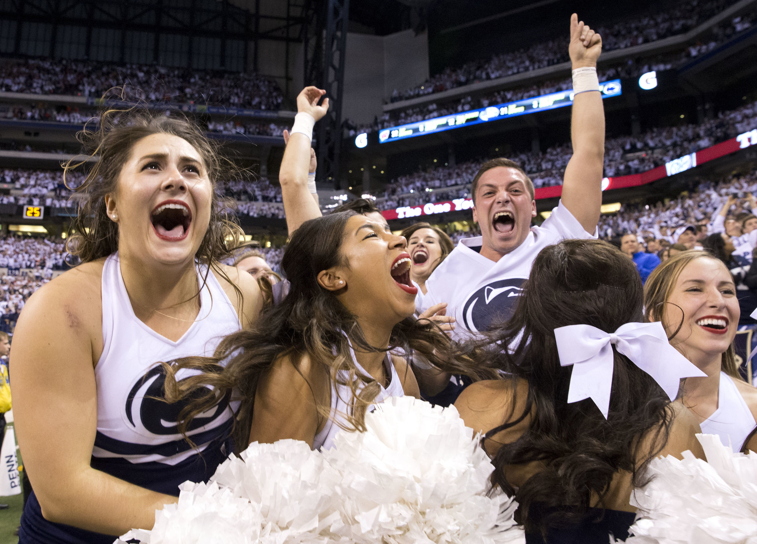  Penn State cheerleaders react after seeing the final minutes in the fourth quarter and realizing that Penn State would be the Big Ten Champions during the Big Ten Football Championship Game between Penn State and Wisconsin at Lucas Oil Stadium in In