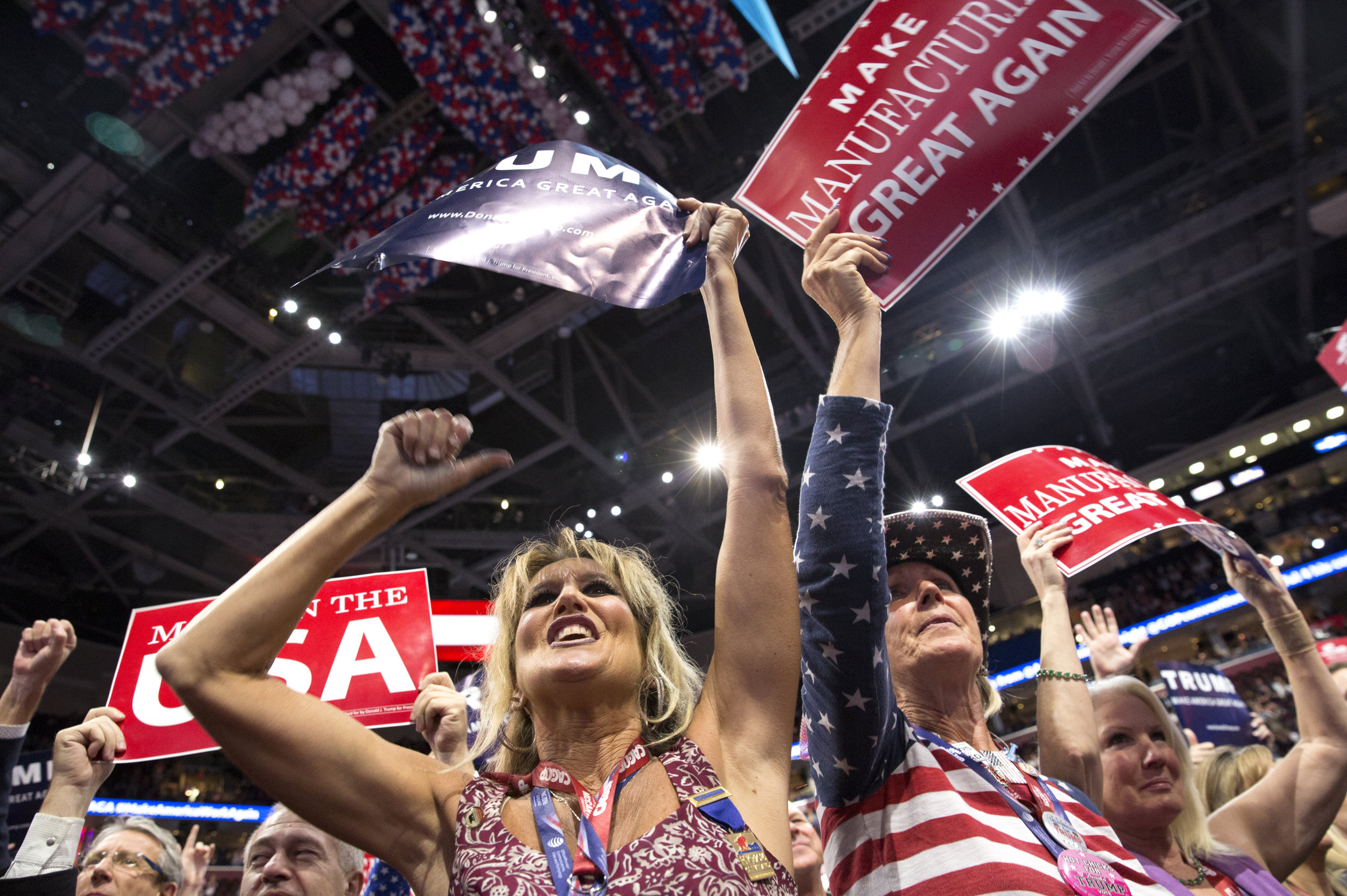 California delegates Kim Davis, left, and Elizabeth Ritchie, right, cheer after Chris Christie mentions Republican nominee Donald Trump on the second day of the Republican National Convention at the Quicken Loans Arena on Tuesday, July 19, 2016. 