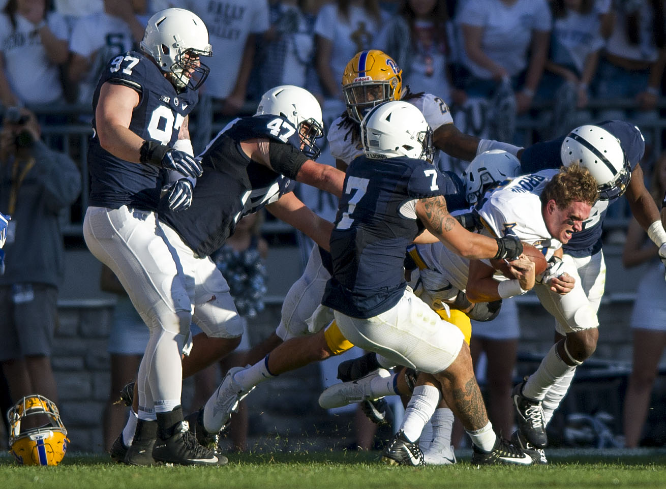  Pitt quarterback Max Browne’s helmet flies off after getting sacked in the second half during the Pitt-Penn State game on Saturday, Sept. 9, 2017 at Beaver Stadium. Penn State defeated Pitt 33-14.&nbsp; 