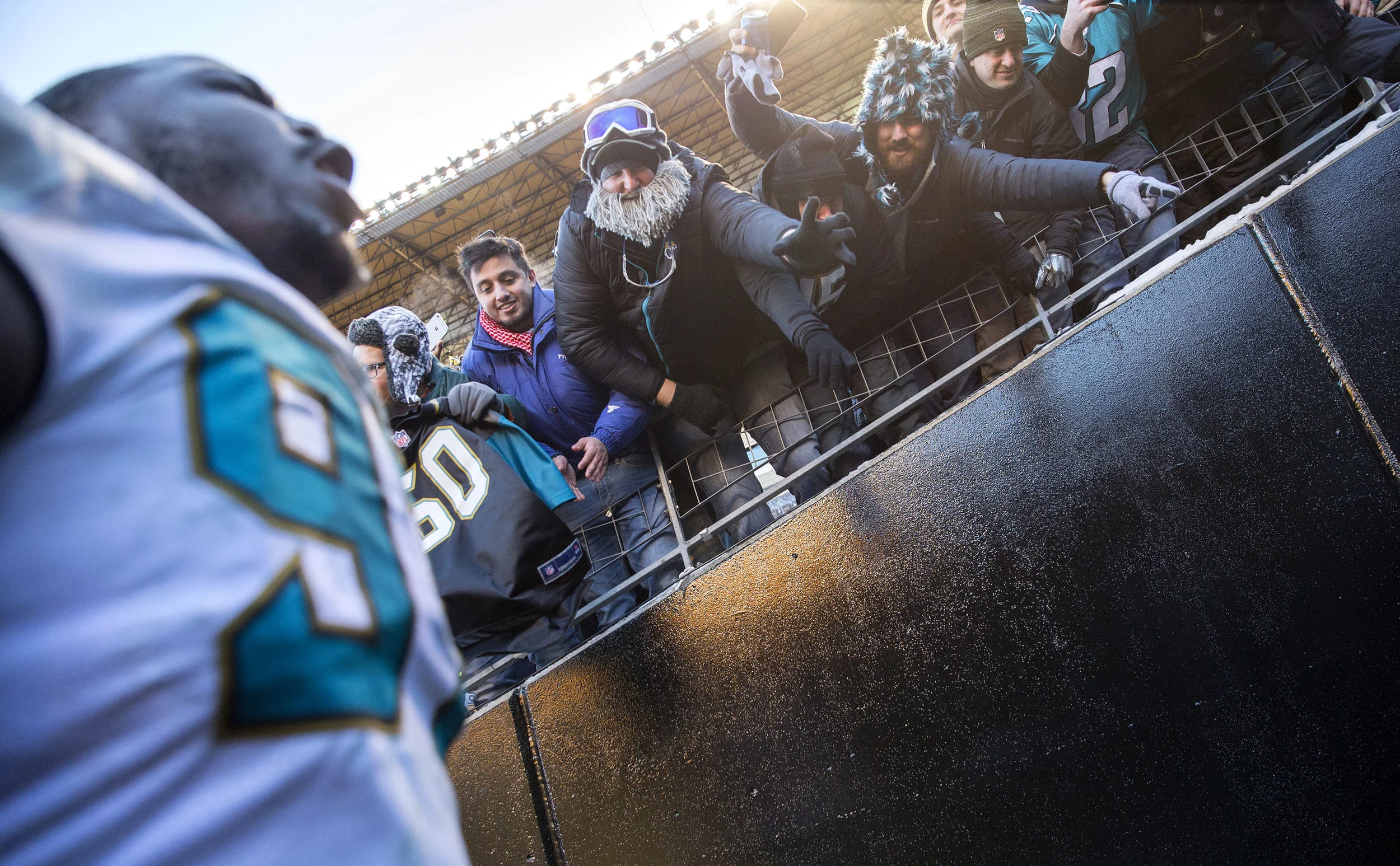 Fans wave at Jaguars Malik Johnson as he screams while entering the tunnel towards the locker room during the divisional playoff game on Sunday, Jan. 14, 2018 at Heinz Field. The Steelers lost to the Jaguars 45-42. 