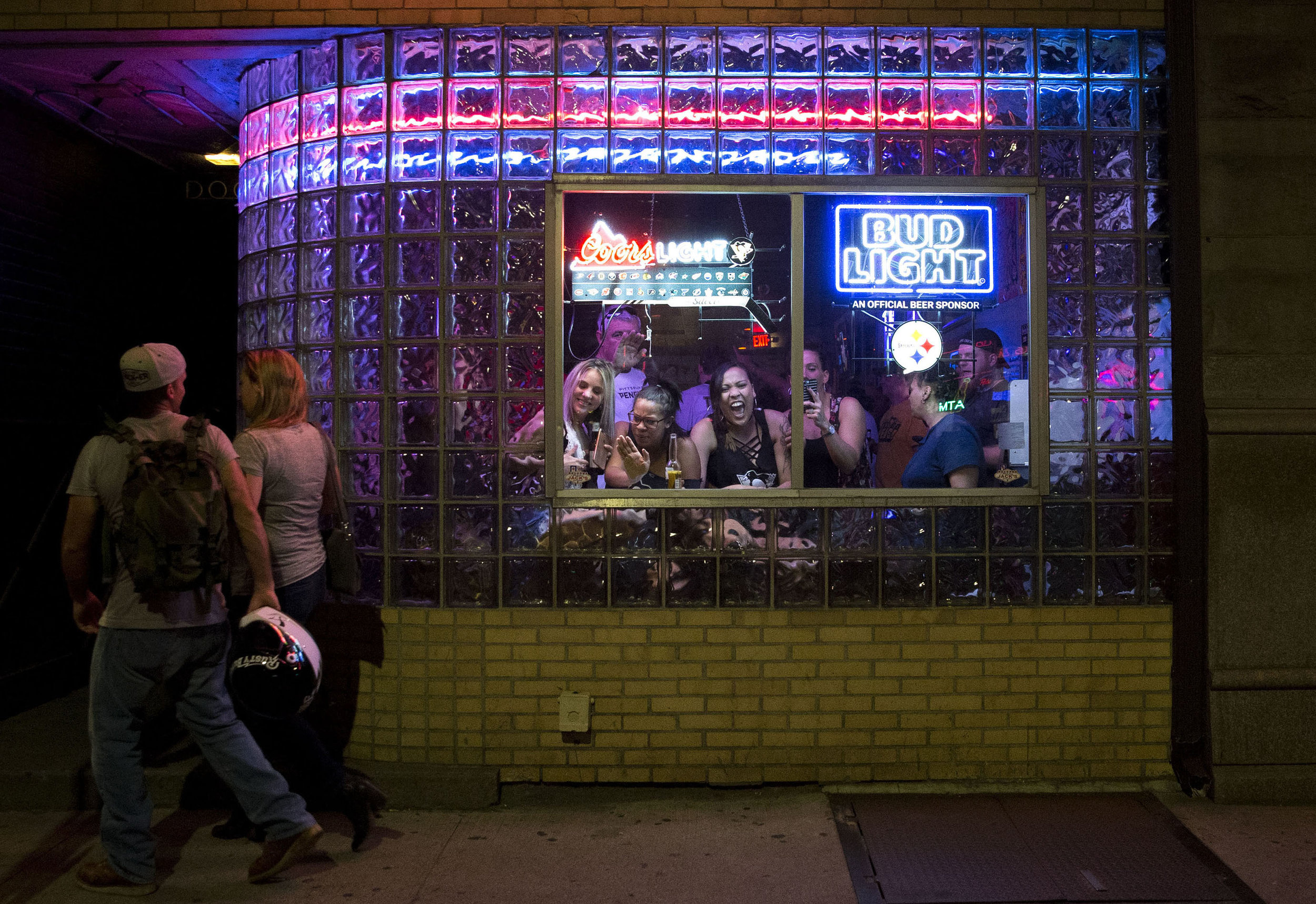 People at Jack’s bar sing ‘Sweet Caroline’ on Carson street after the Penguins won their second straight Stanley Cup on Sunday, June 11, 2017. The Penguins defeated the Predators 2-0 during game 6 of the Stanley Cup final.