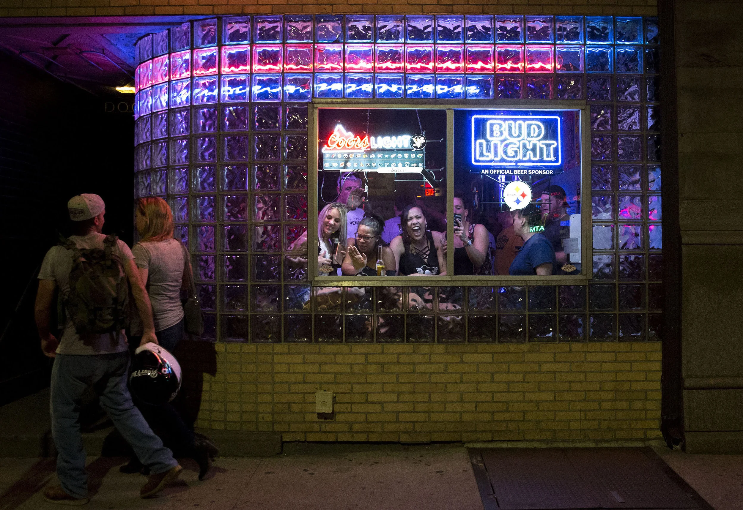 People at Jack’s bar sing ‘Sweet Caroline’ on Carson street after the Penguins won their second straight Stanley Cup on Sunday, June 11, 2017. The Penguins defeated the Predators 2-0 during game 6 of the Stanley Cup final.