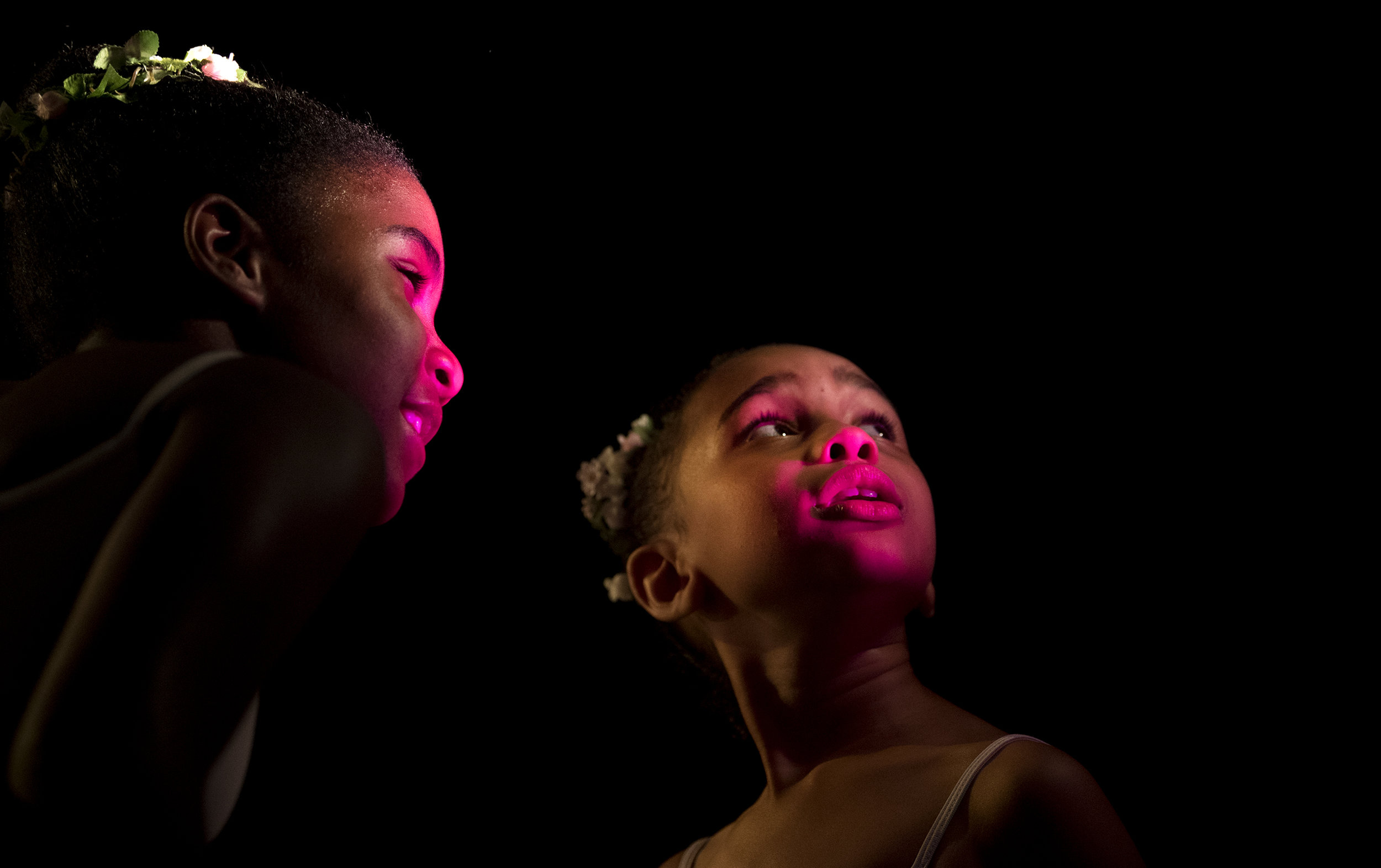  Ava Dominick, left, 10, and Neema Smith, 7, look at the stage light before getting ready for dress rehearsal with the Pittsburgh Ballet Theatre School in preparation for their May Spring Performance on Thursday, May 24, 2018 at the Byham Theater.  