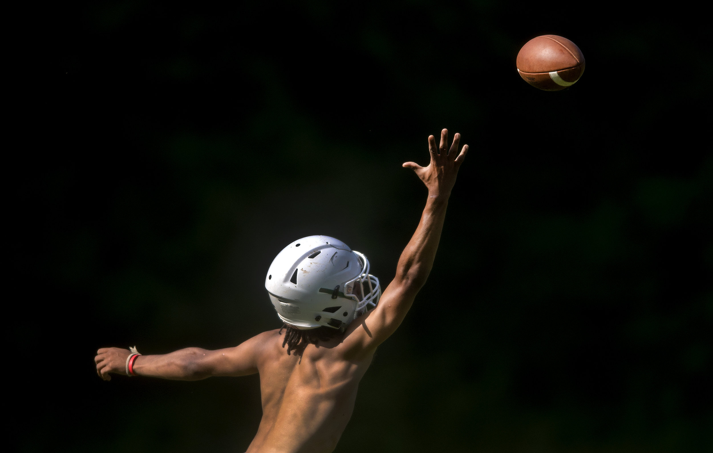  Riverside’s LeMarcus Cleckley reaches to catch the ball during a summer practice on Wednesday, July 11, 2018, at Riverside High School. 