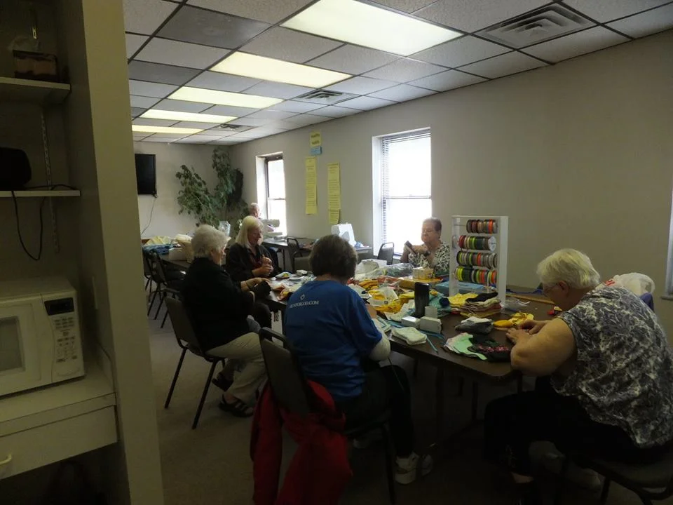 Messiah's Stitching Servants working on projects for missions.jpg