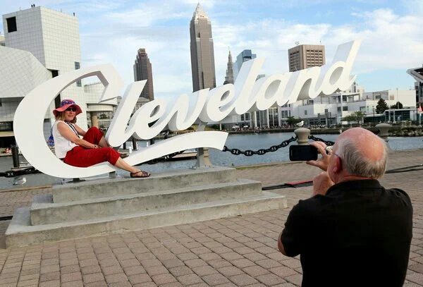 Visitors to Cleveland take in the skyline. A group of Cleveland boosters hopes to make the city a destination for art.