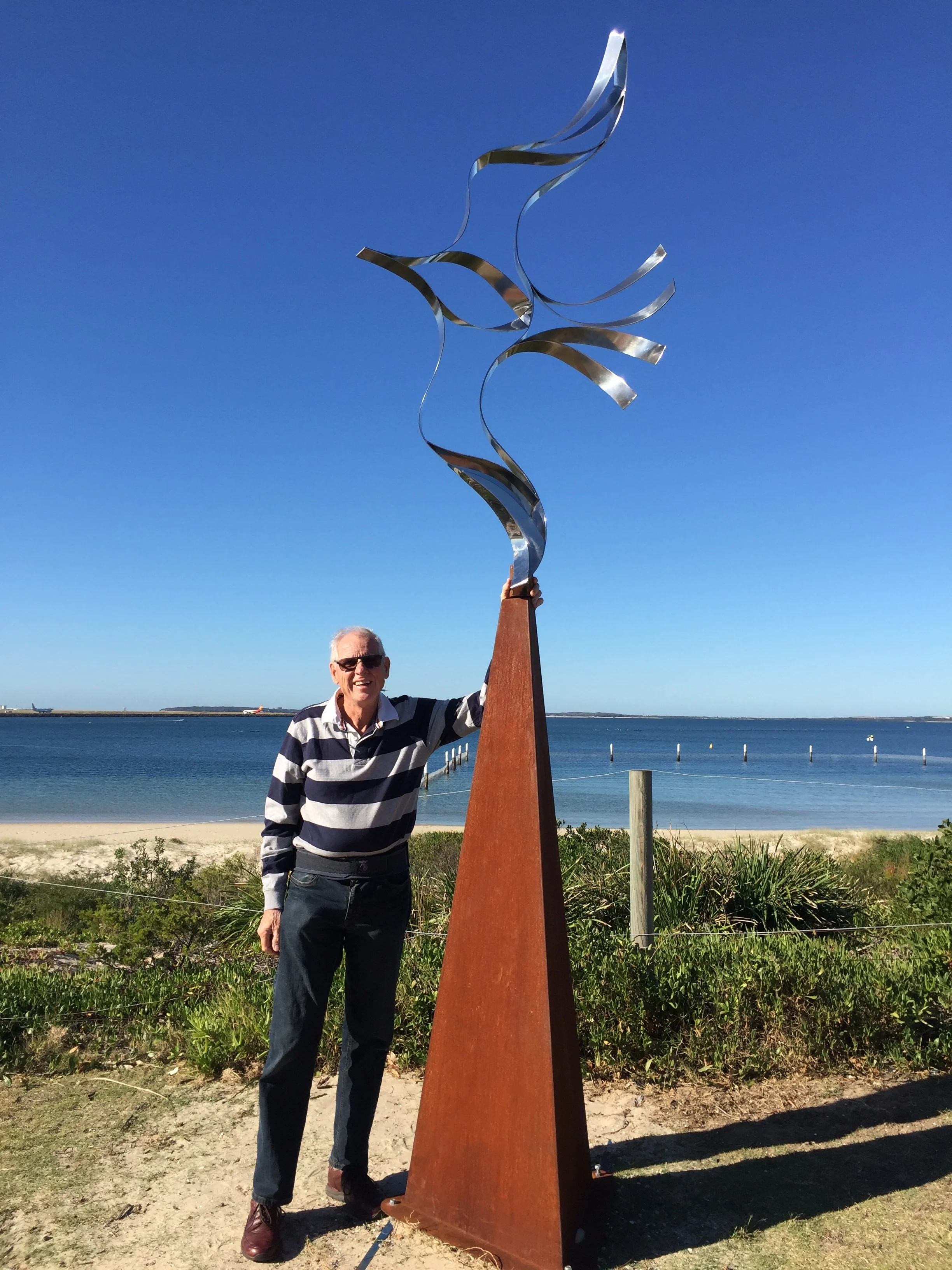 ‘Wings of Dreams’ Materials: Marine grade stainless steel and corten steel Artist Statement: The form depicts the freedom of a bird soaring in the sky as the sculpture moves freely in the wind. The sculpture is an expression of our desire for total freedom to attain personal achievements. Every achievement starts with the freedom to Dream! 2017 First prize outdoor sculpture - Queensland Royal National Show