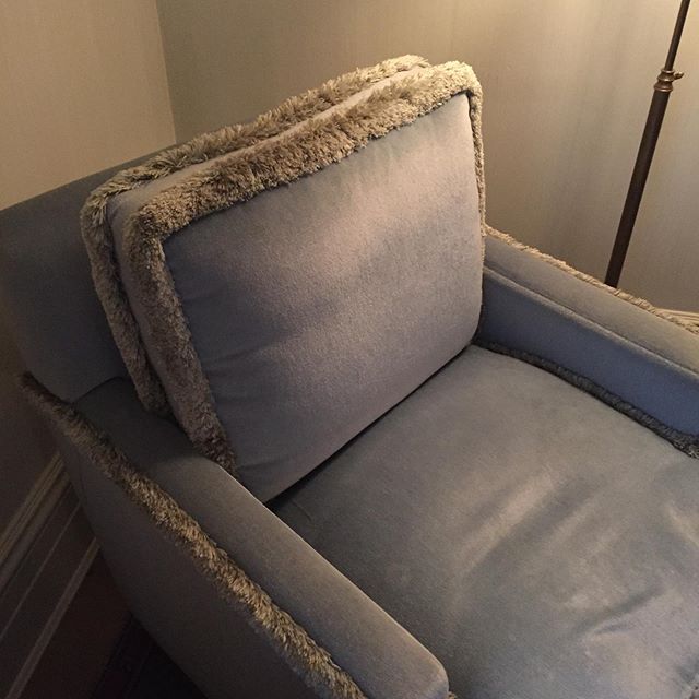 Mohair armchair with linen fringe in a cozy corner; just what you want to find in a hotel room! Designed to make you want to stay forever.....#nyc #greenwichhotelnyc #armchair #mohair #design #cozy #paleblue #details #upholstery #comfort #thanksgivin