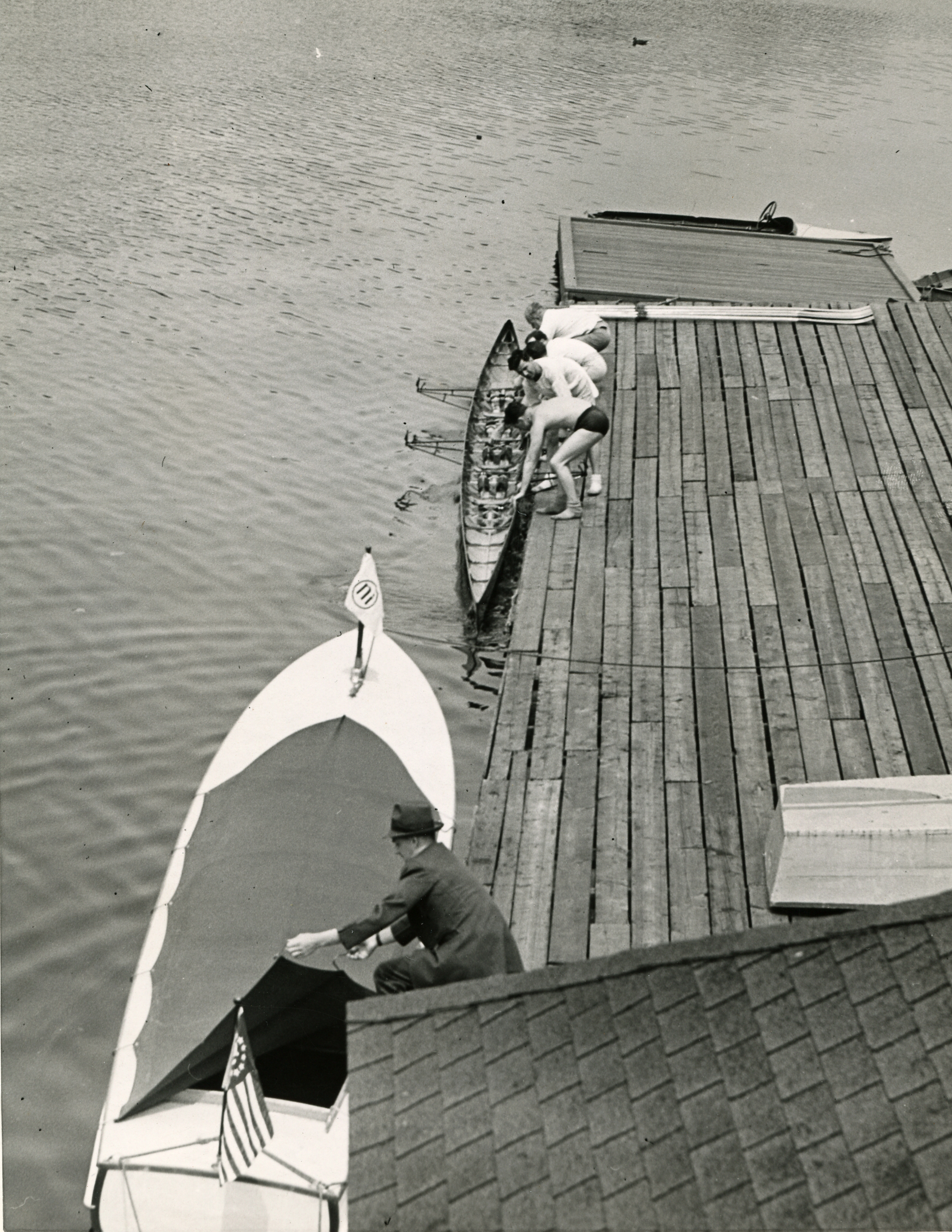 The White Swan and a rowing shell at the Company dock on the Charles River