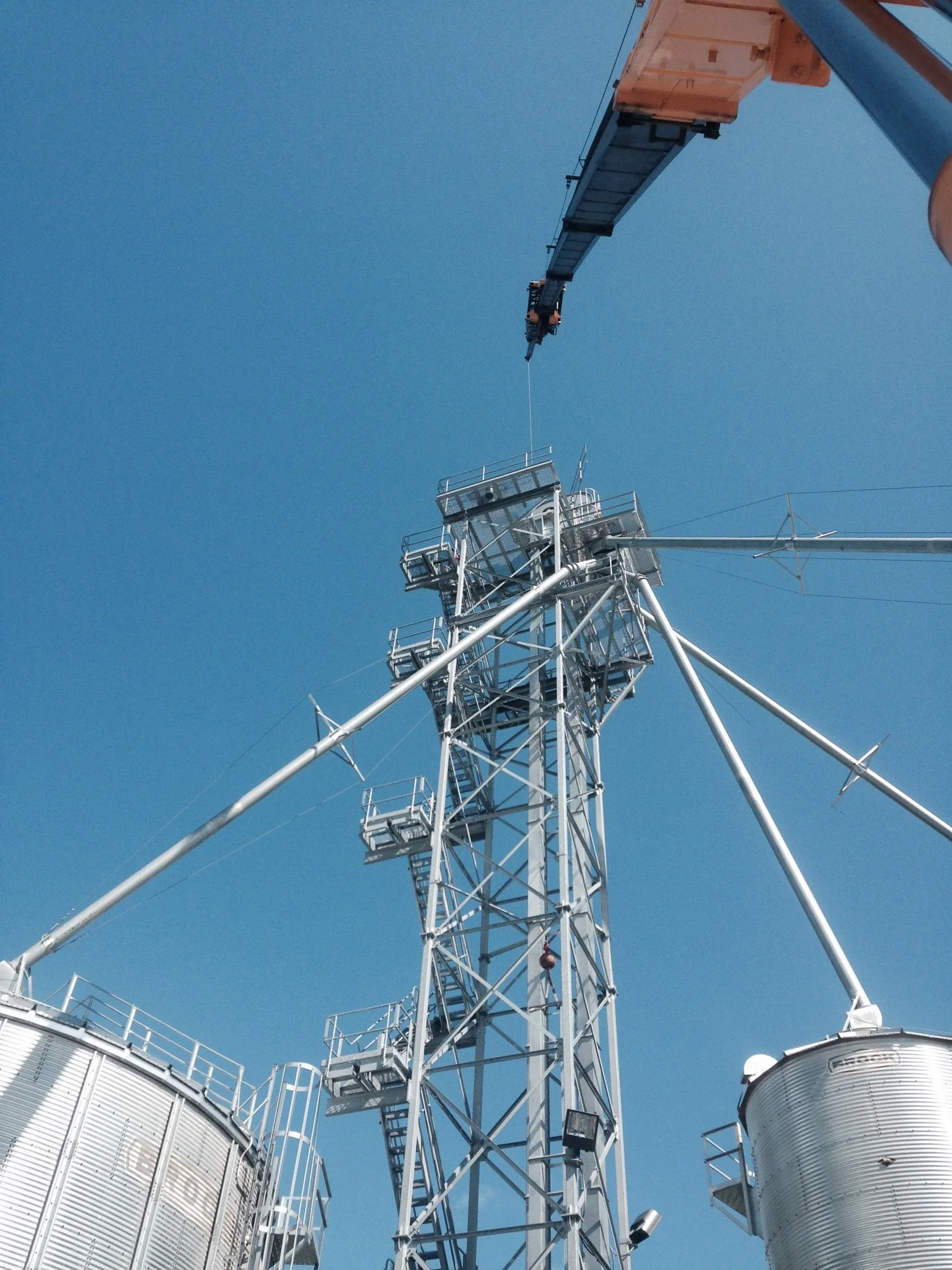 Mark Knepp is the crane operator for this 120 foot grain leg set for Obermeyer Ag Group at Holland Farms in Milroy, IN.