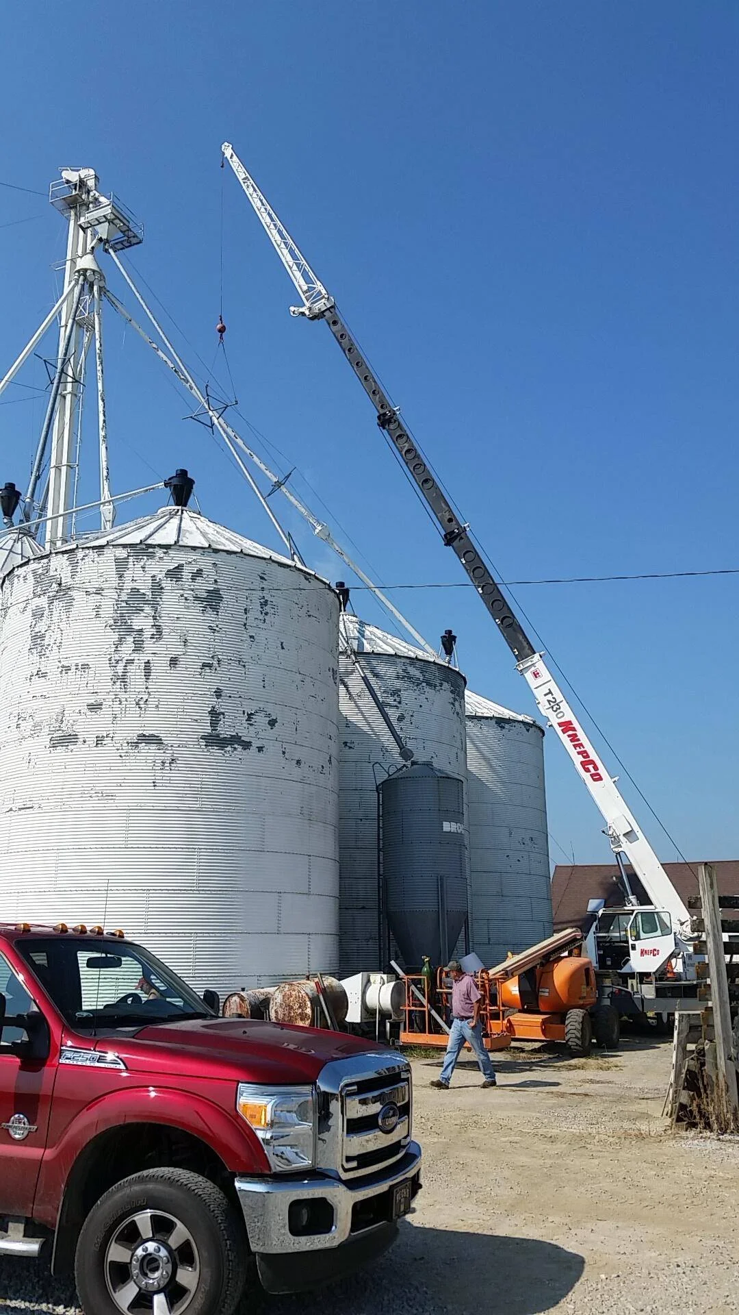 Joas Knepp providing crane services for a grain pipe replacement in Rushville, IN.