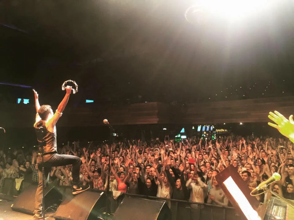 Tim continues to tour with “Postmodern Jukebox” as the enigmatic “Tambourine Guy.” Photo is from Moscow, Russia.
