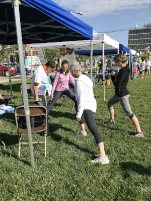 Soriano leading movement with Parkinson's patients and their care partners. 