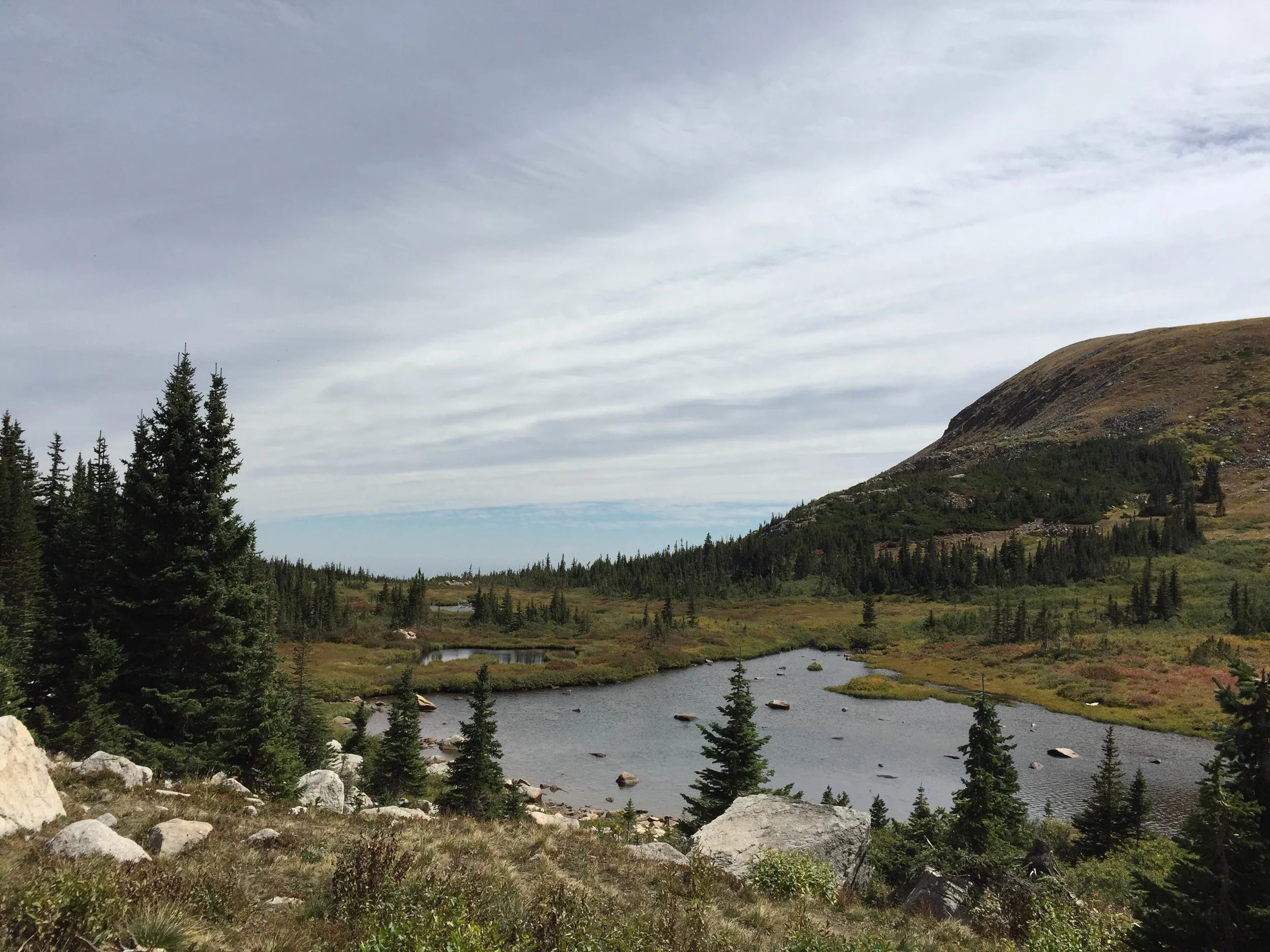 It was the worst two miles of my life. One uphill climb after another, and barely a trail at all in some points. After scrabbling up a massive mound of rocks, I glimpsed this body of water. Blue Lake! Nope. A stick-toting senior citizen coming back the other way told me I had another mile to go. I was only halfway there?!? “You can do it!” he chirped, adding as he vanished downhill, “It’s not that other little lake up there either.”