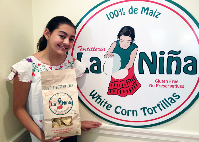 "LA NINA" posing with the logo. 