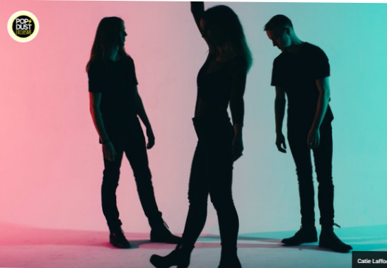 There's no doubting DC-area synth-pop trio SHAED make truly "colorful music." Last fall's debut EP, Just Wanna See , is a kaleidoscopic mixture of vibrant EDM tones, house music and moody Top 40 hooks--all expertly blended together into a cinematic and sometimes psychedelic concoction. Lead vocalist Chelsea Lee pierces through the rising and falling sonic waves, set in motion by twin brothers Max and Spencer Ernst; Lee is the driving voice here and never appears to struggle against the pitter-patter of club beats as found on such deep cuts as "The News" and the echoing "Running Through the Fields." But it is their current single "Perfume" that is the most immediate, leaving traces of that irresistible hook on the brain, sticky and sweltering. "You better believe I fell in love with you," Lee confesses over the drip-drop of the oozing production. "Dippin' the pen again 'cause I want to claim you." Popdust is beyond honored to get our hands on the new lyric video, premiering today. The visual sweeps and circles around rainbow-flecked quartz crystal, an evident metaphor of cherished love and only serves to heighten the song's mesmerizing feel. "When we were writing 'Perfume' we envisioned the Marie Antoinette era with powdered wigs, drama queens, and fine china," says Lee about the song. Lee then coos, "I'll write the rules and you will sign your name. Ink dries, I cut ties so move quickly my dear." "Baby, I choose you like new perfume. Not gonna lose you. Never gonna wash you off," vibrates the chorus, leading into the brash second verse. "Drippin' grace outside as I sip my tea. Conversations closed til you send me your deal. I'm not the type to sit and wait around. Rather have another drink and drown." SHAED's Just Wanna See EP is out now on iTunes .