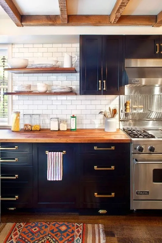 We love the warmth the hard wood counter tops bring to this kitchen