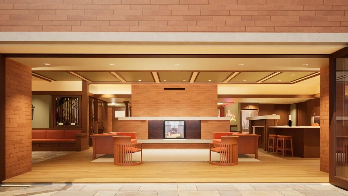  Rendering looking in from the terrace through fully opened folding glass doors to a living room with a central brick fireplace, orange sofas and barrel chairs. 