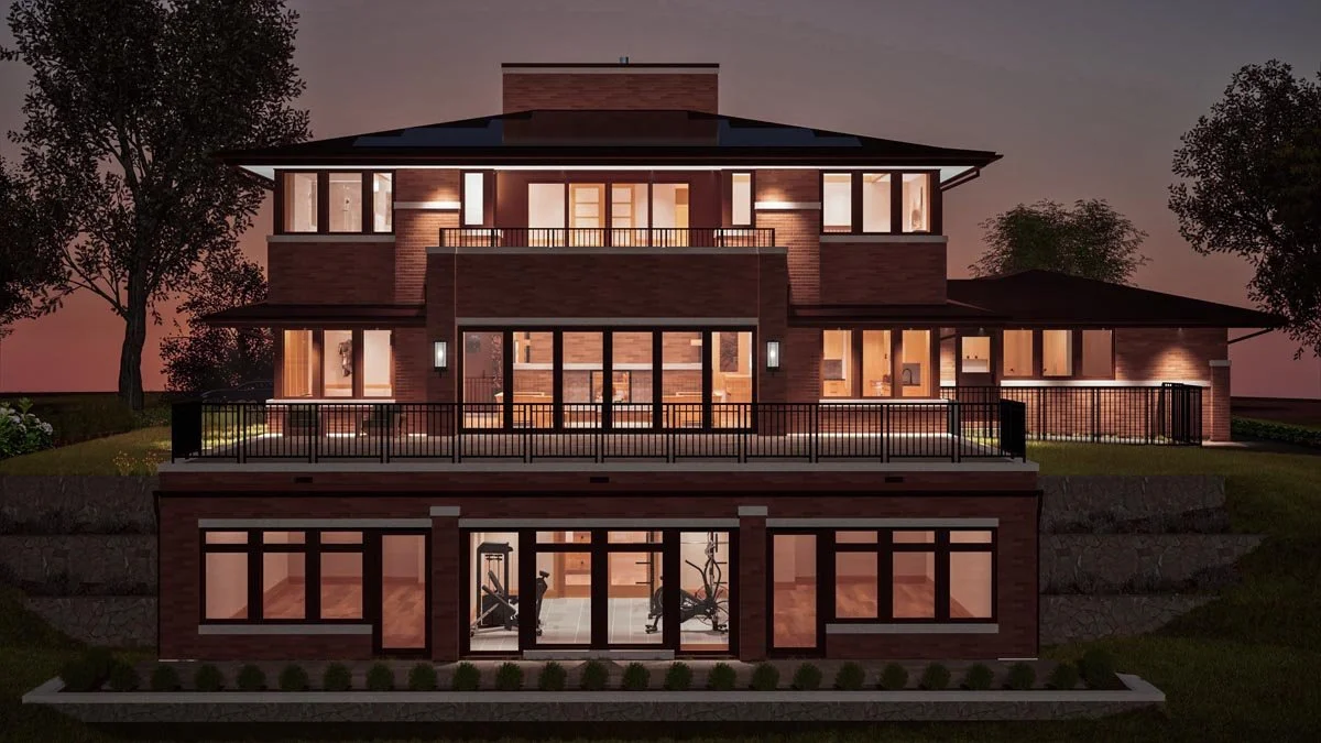 Dusk rendering of the lake side of a three-level brick home, with a railed terrace, an upper balcony and a lit walkout lower level with a home gym. 