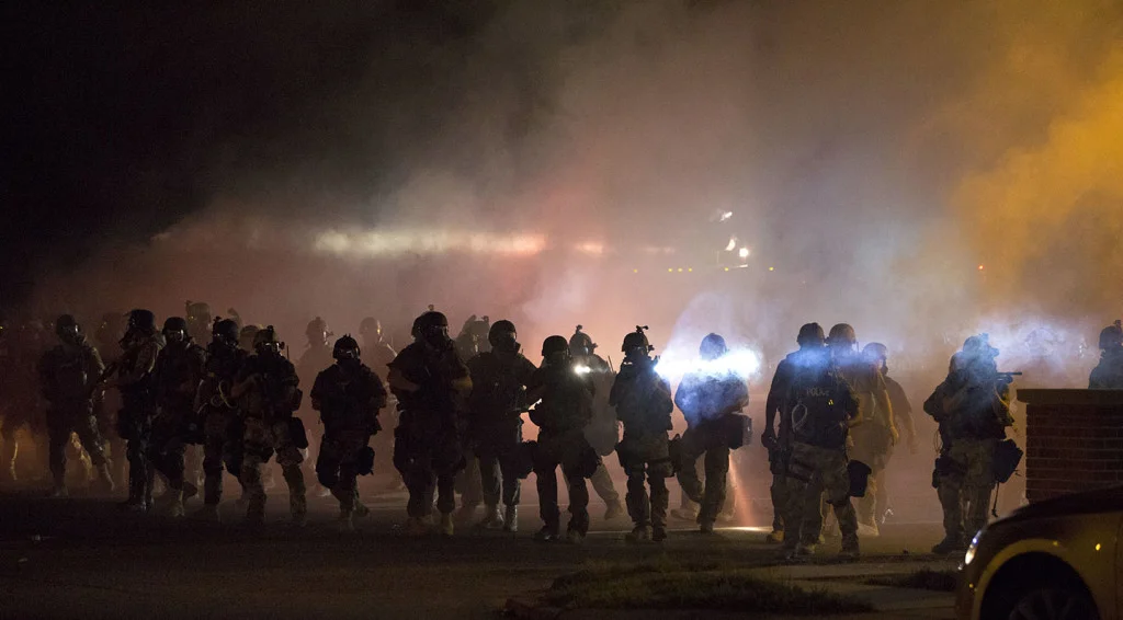 Riot police in Ferguson (via Slate )