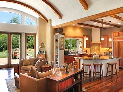 Great room with exposed curved beams.