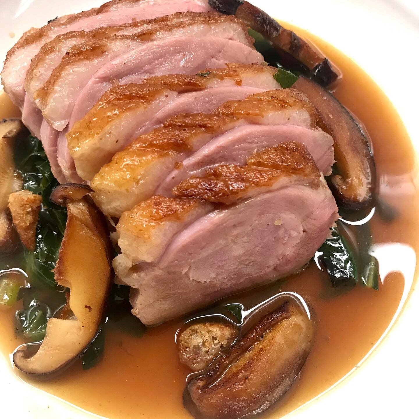 Sous vide duck breast stuffed with duck sausage over sautéed mushrooms, collard greens, and a duck broth infused with collards potlikker that I like to call... Ducklikker Broth! We&rsquo;re not ducking around with this one. #personalchef #atlantaper