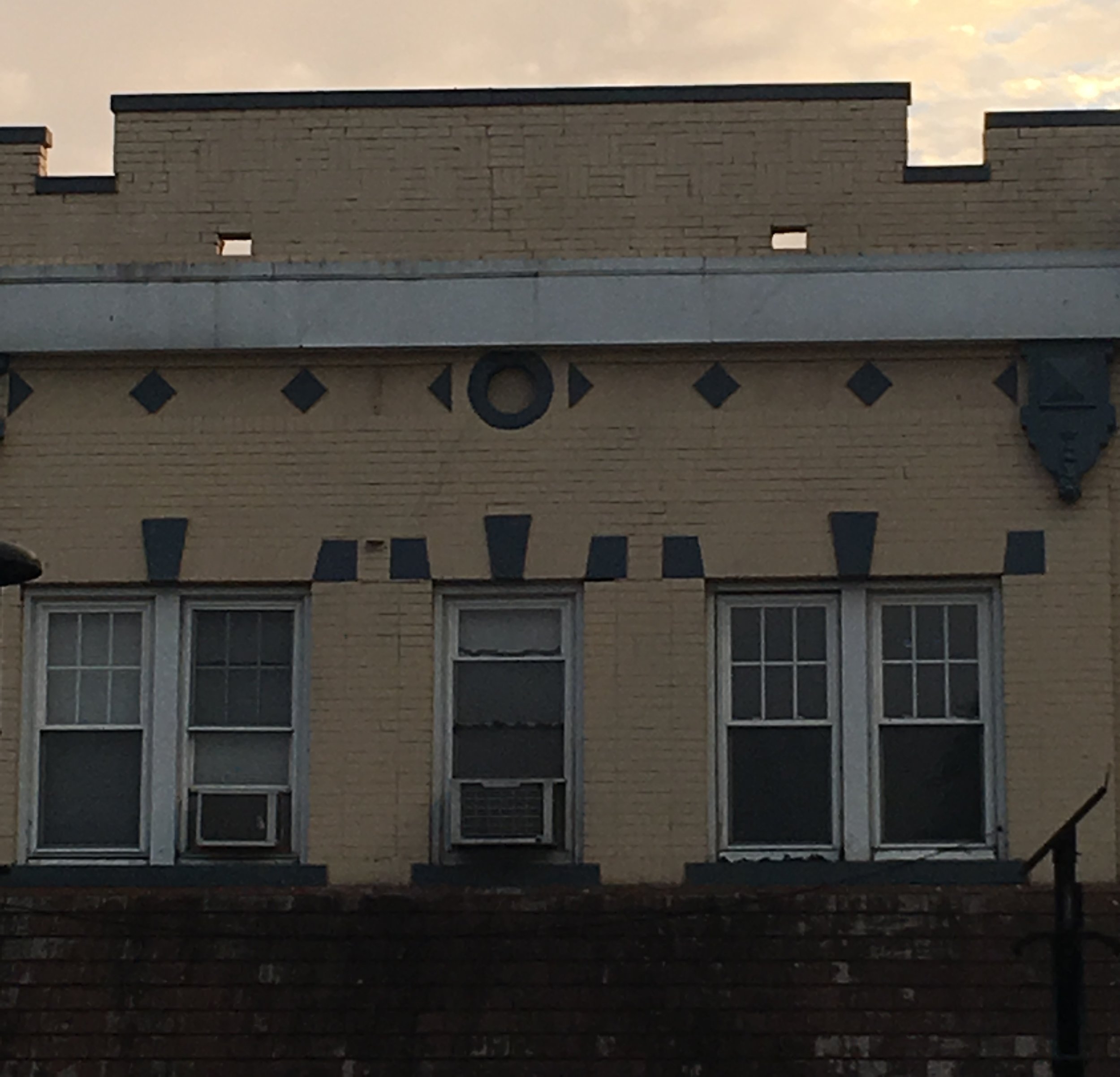Notice 2 scuppers at the foot of the parapet wall. 
