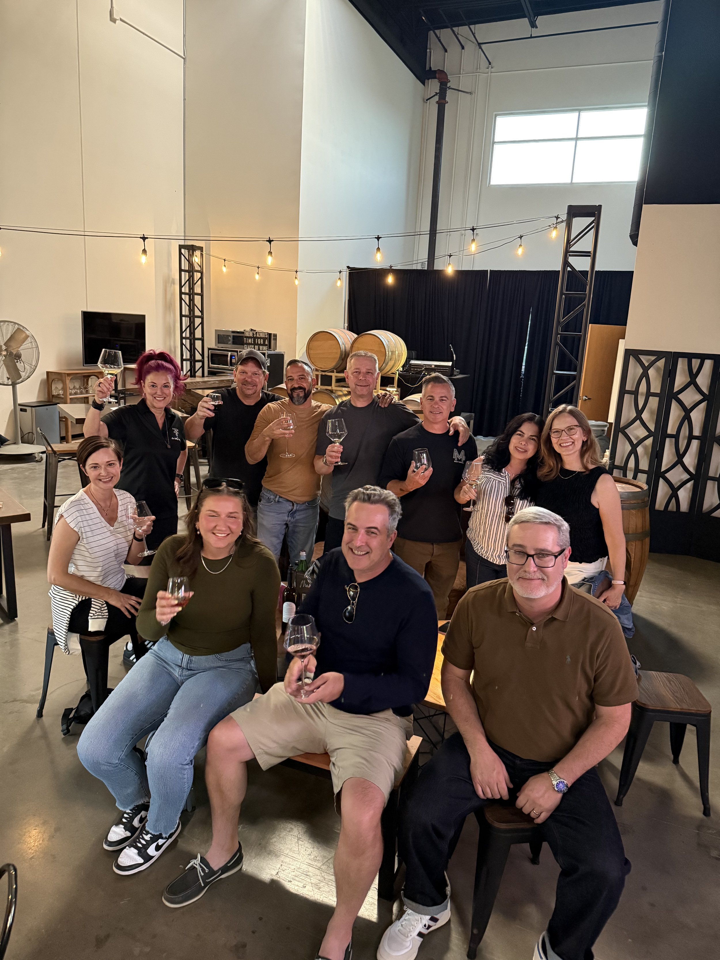 Group of friends enjoying wine in the tasting room.