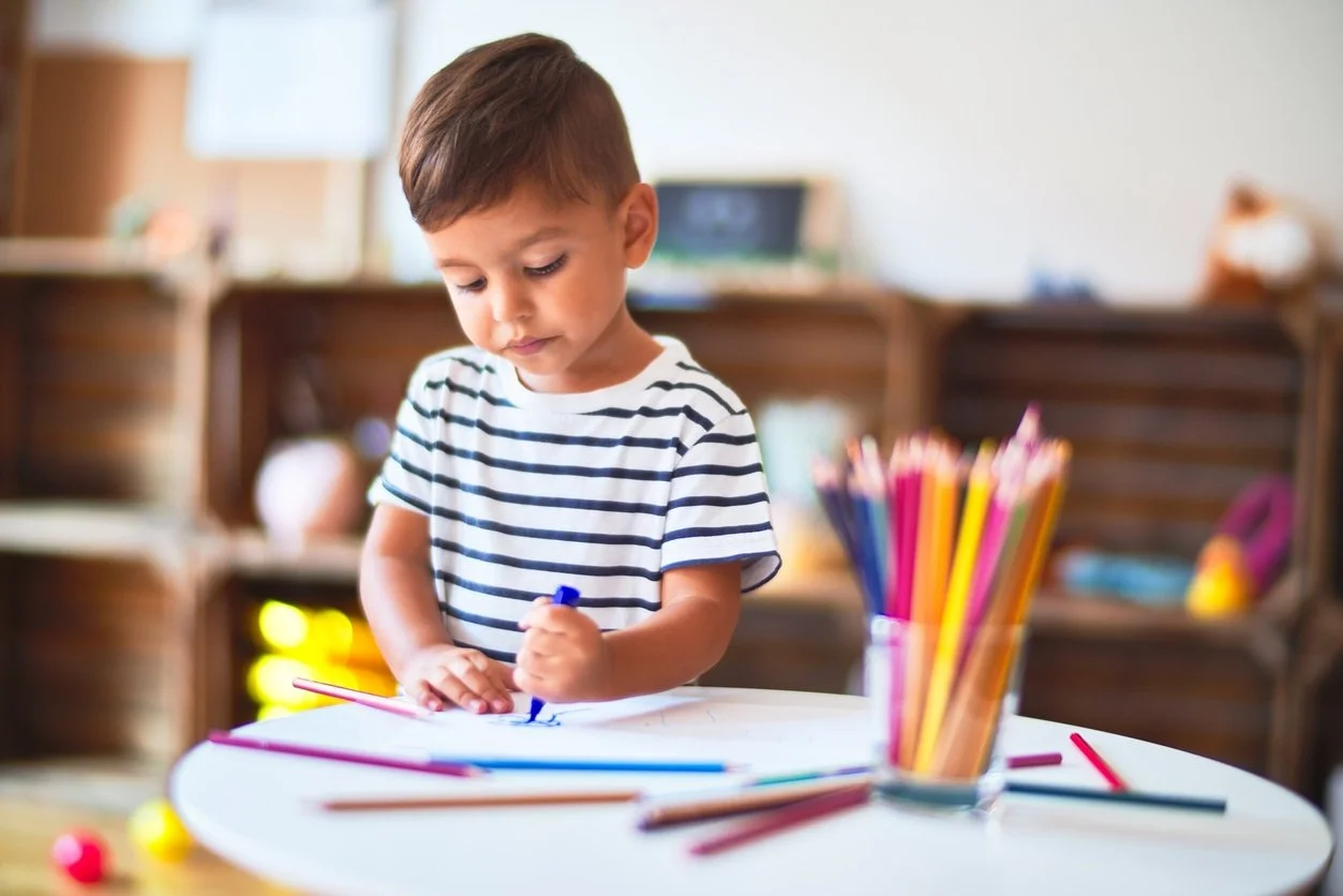 Beautiful-toddler-boy-drawing-cute-draw-using-colored-pencils-at-kindergarten-1185932018_1257x838.jpeg