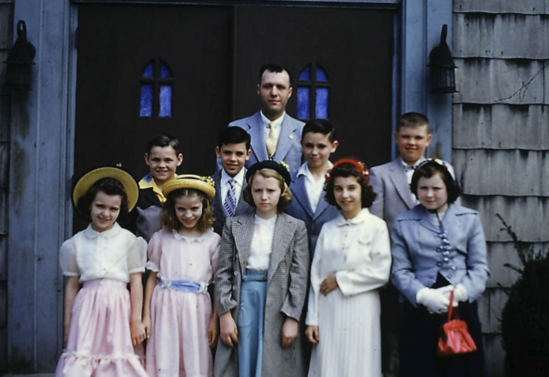    Sunday School teacher, Ed Warneld, and his class outside the "old church" in 1952. While some of the faces are unknown to us, included in the front row are Midge Oelschlager, Donna Cherpack and Anna- Louise Warneld; in the back row far right is Di