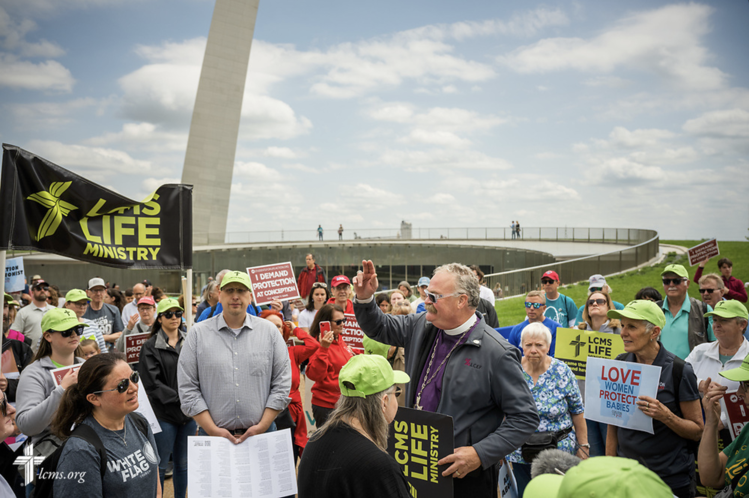  The Rev. Dr. Matthew C. Harrison, president of the LCMS, addresses fellow Lutherans at the March on the Arch on Saturday, April 29, 2023, in St. Louis.   LCMS Communications/Erik M. Lunsford  