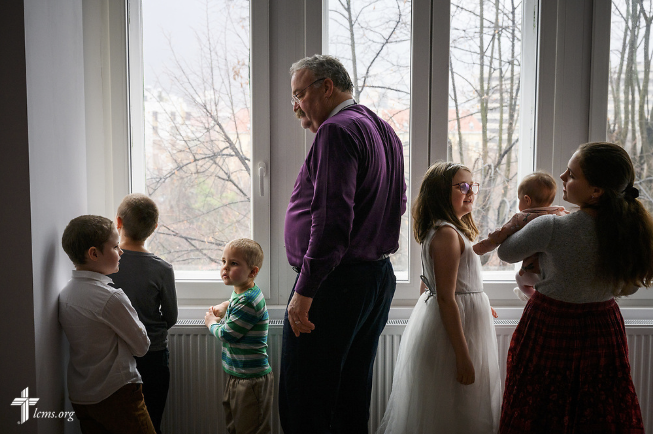  The Rev. Matthew C. Harrison, president of the LCMS, visits with LCMS missionary children following Divine Service at the Confessional Lutheran Church in Romania (Biserica Lutherană Confesională din România) St. Mary's Lutheran Center on Sunday, Feb