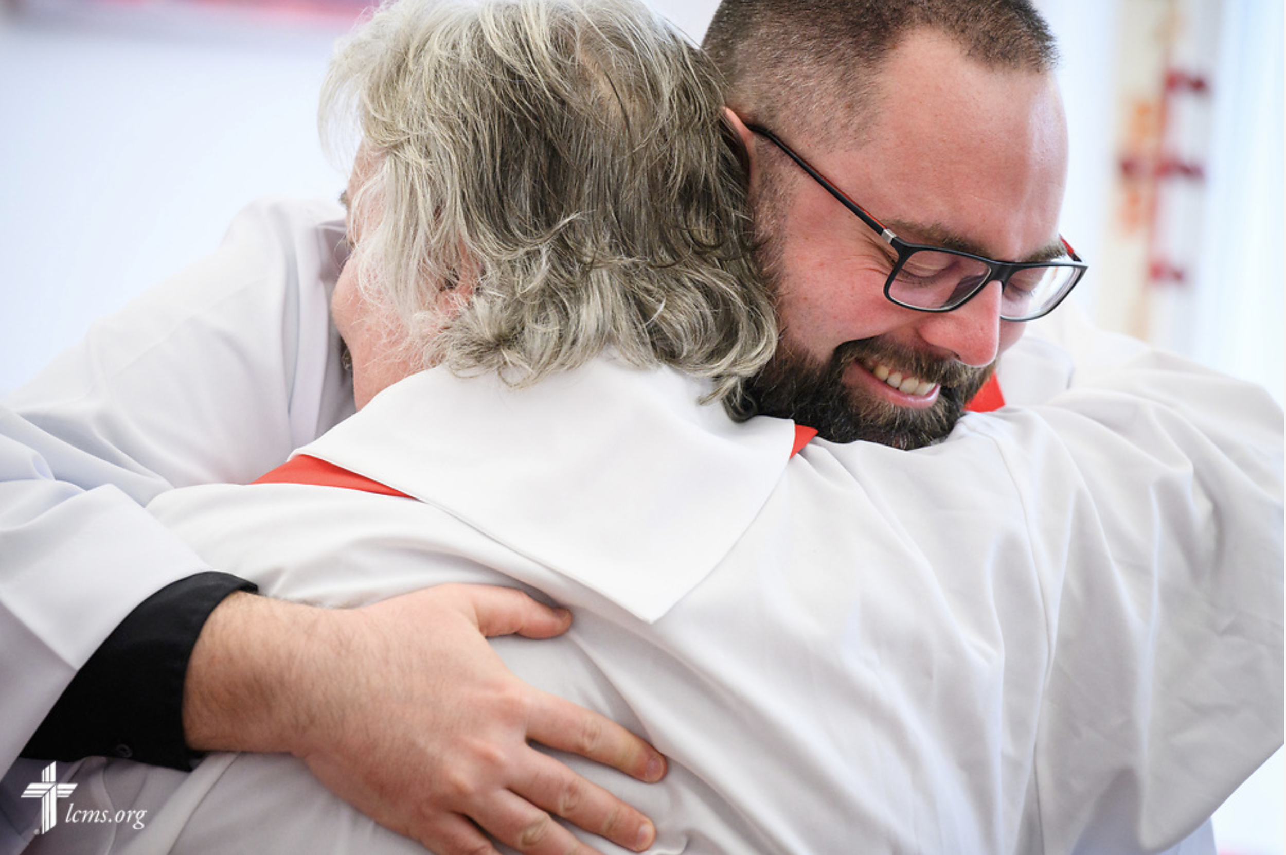  The Rev. Andrew Fedder, LCMS missionary, hugs the Rev. Arthur Bojinov of the Confessional Lutheran Church in Sofia, Bulgaria, following Bojinov’s ordination during Divine Service at the Confessional Lutheran Church in Romania (Biserica Lutherană Con