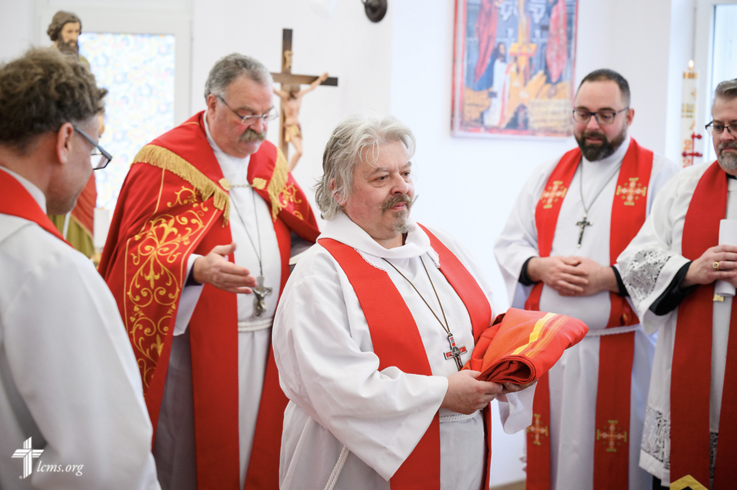  The Rev. Arthur Bojinov of the Confessional Lutheran Church in Sofia, Bulgaria, displays his gifted stole following his ordination during Divine Service at the Confessional Lutheran Church in Romania (Biserica Lutherană Confesională din România) St.