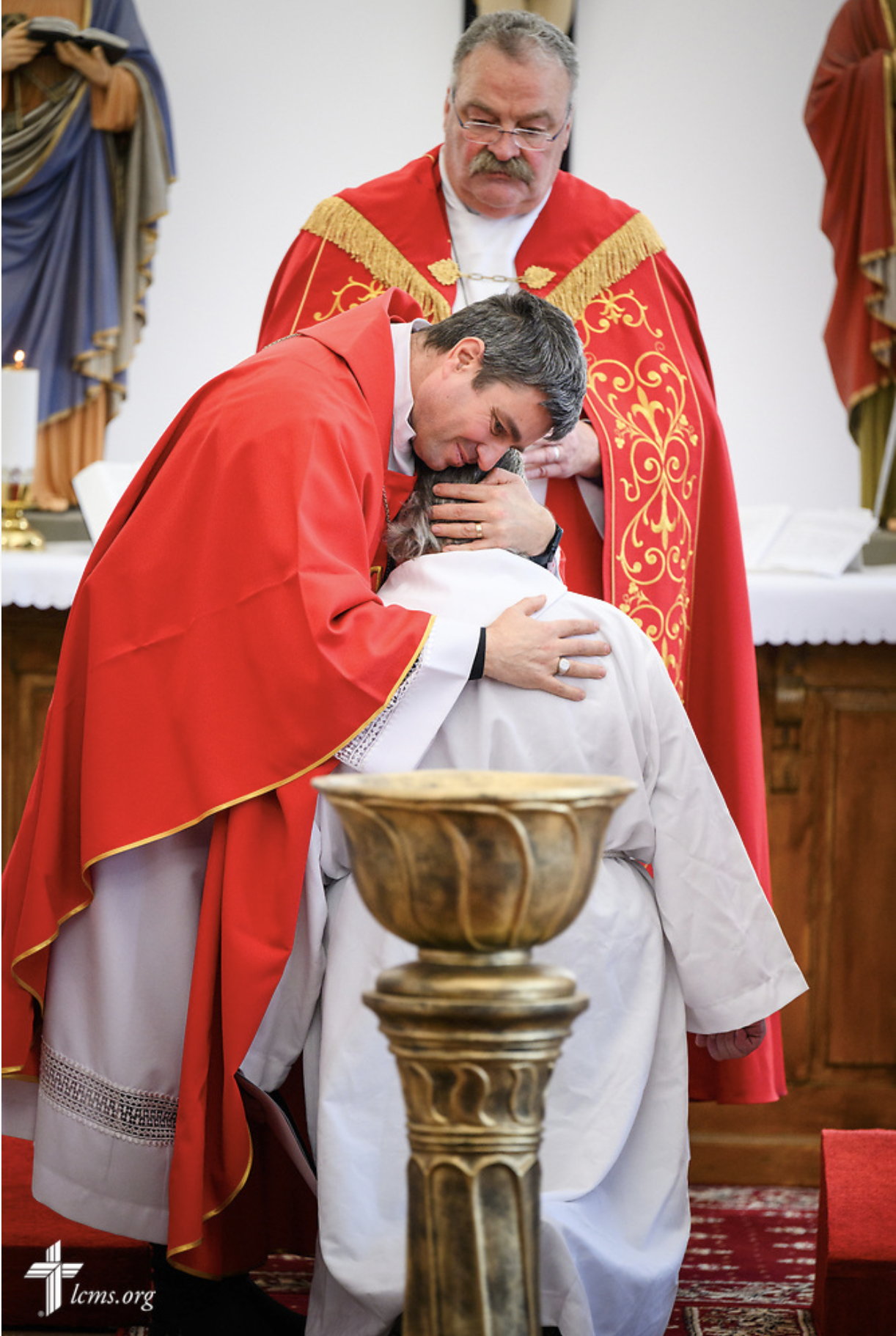  The Rev. Sorin Horia Trifa, LCMS alliance missionary, warmly embraces lays the Rev. Arthur Bojinov of the Confessional Lutheran Church in Sofia, Bulgaria, during his ordination at Divine Service at the Confessional Lutheran Church in Romania (Biseri