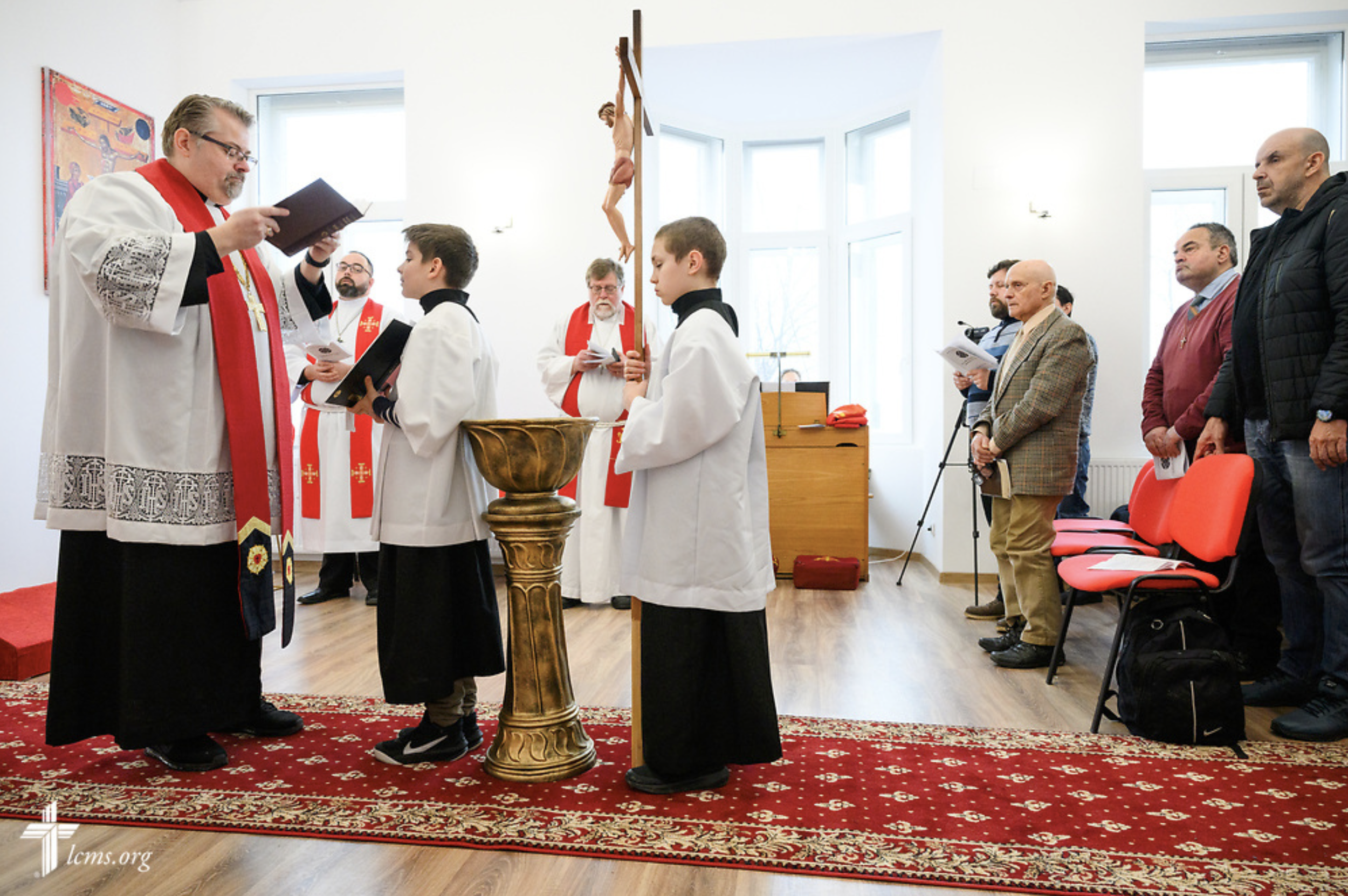  The Rev. Dr. Cory Rajek, executive director of the LCMS Office of International Mission, reads the Gospel reading during Divine Service at the Confessional Lutheran Church in Romania (Biserica Lutherană Confesională din România) St. Mary's Lutheran 