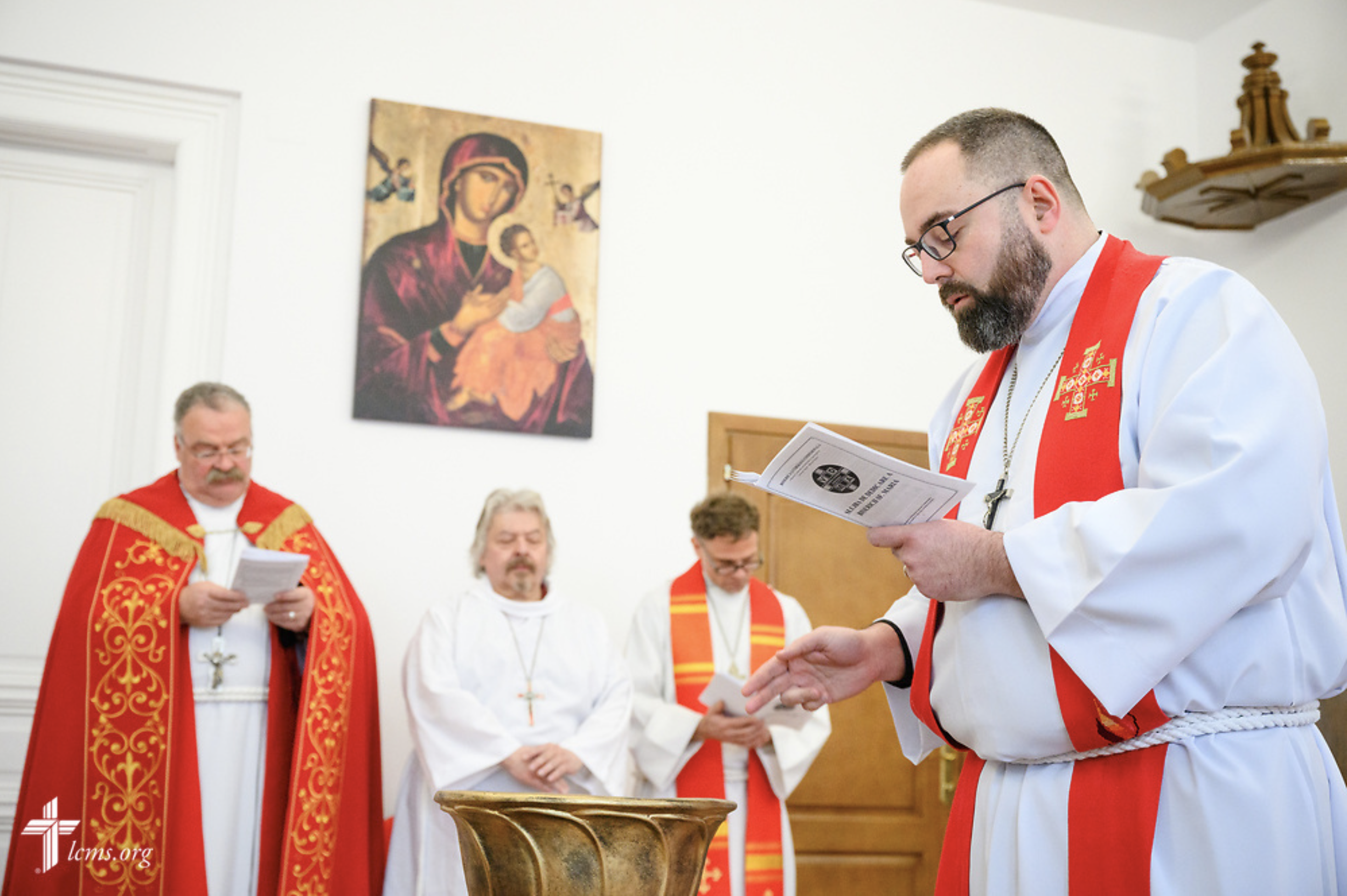  The Rev. Andrew Fedder, LCMS missionary, dedicates the baptismal font during Divine Service at the Confessional Lutheran Church in Romania (Biserica Lutherană Confesională din România) St. Mary's Lutheran Center on Sunday, Feb. 18, 2024, in Brașov, 