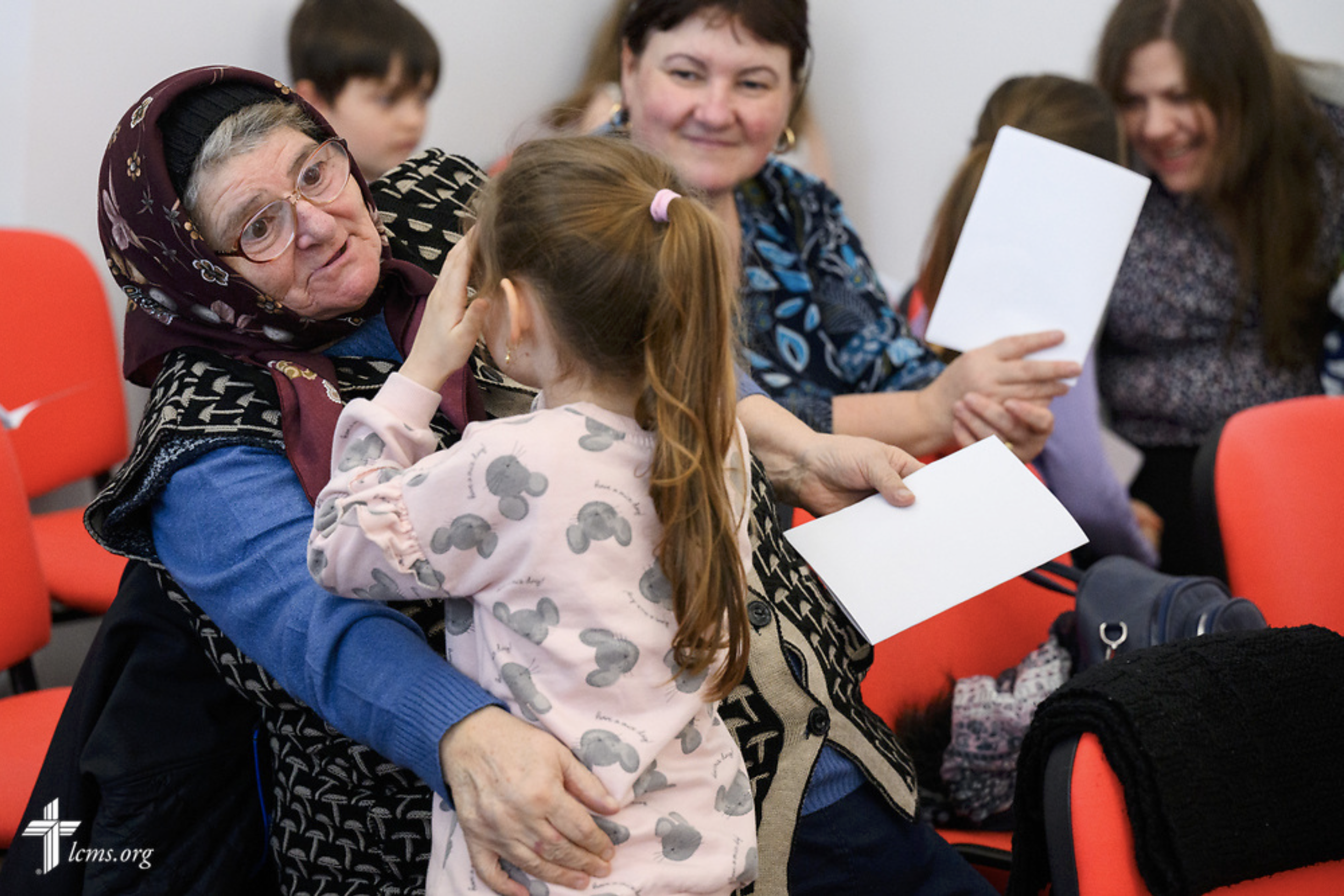  Worshippers greet one another before Divine Service at the Confessional Lutheran Church in Romania (Biserica Lutherană Confesională din România) St. Mary's Lutheran Center on Sunday, Feb. 18, 2024, in Brașov, Romania. LCMS Communications/Erik M. Lun